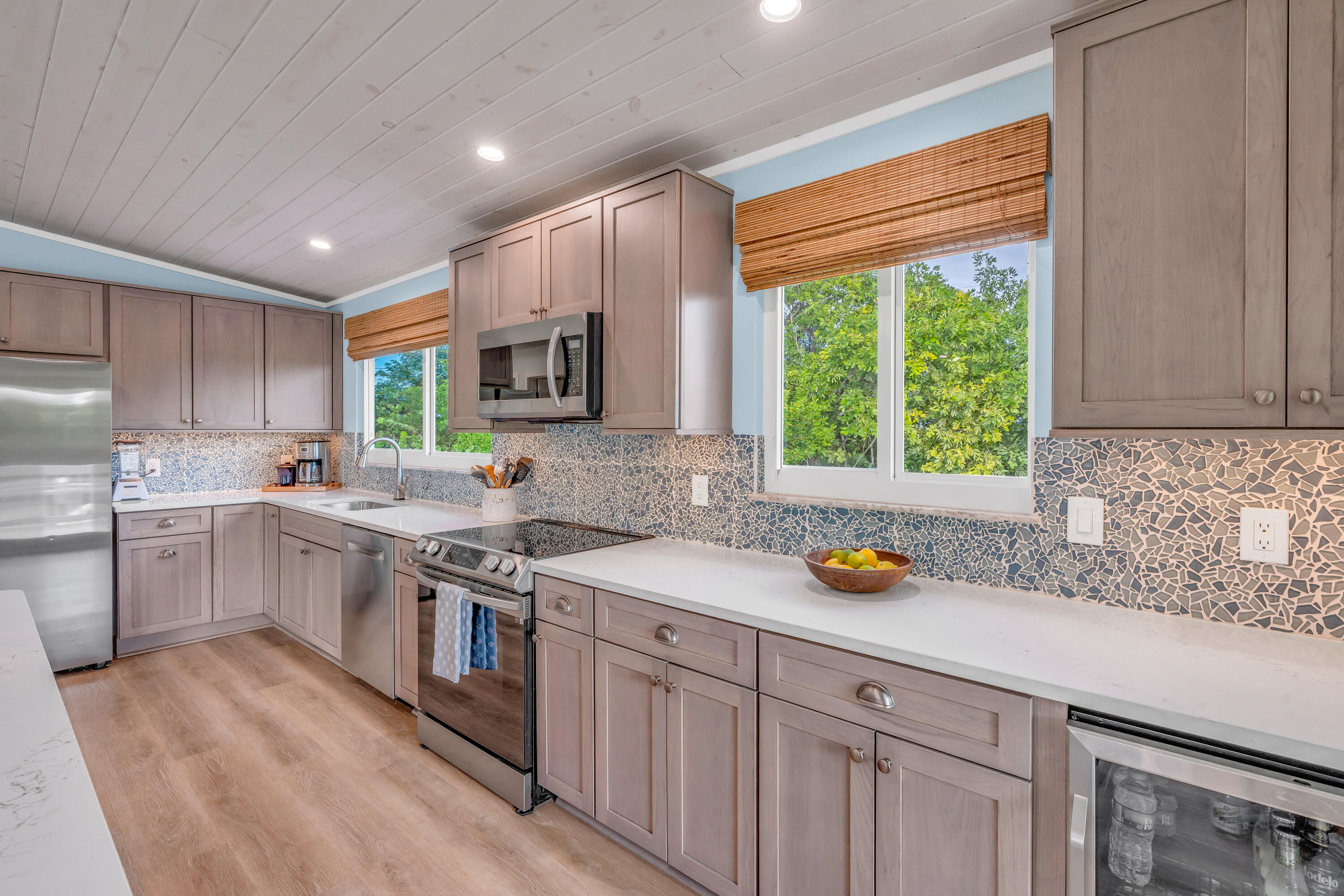 3987 Gordon Road Big Pine Key, FL 33043 - Photo 15 of 49 a kitchen with a sink a window stainless steel appliances and cabinets