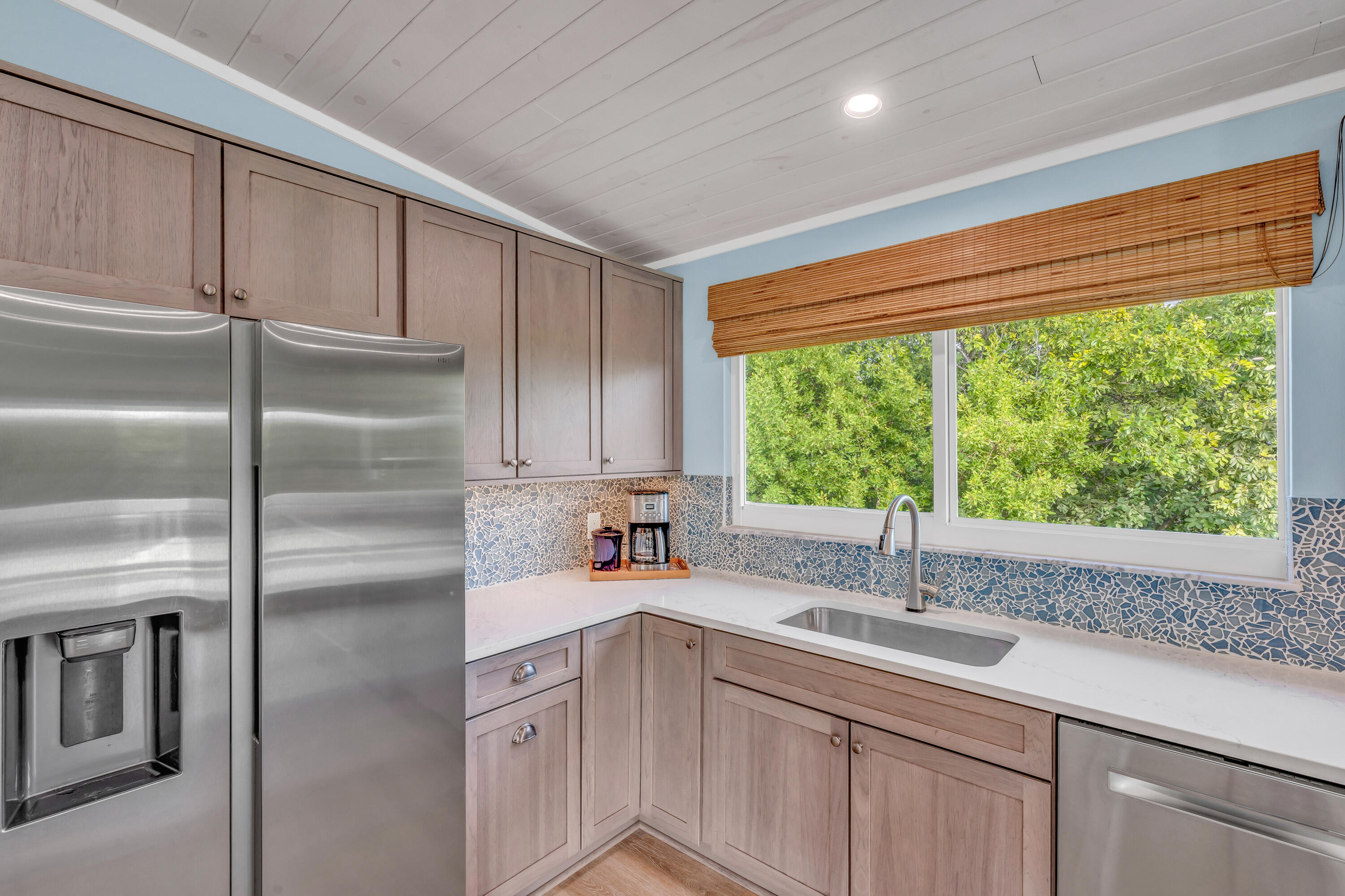3987 Gordon Road Big Pine Key, FL 33043 - Photo 16 of 49 a kitchen with a sink and refrigerator