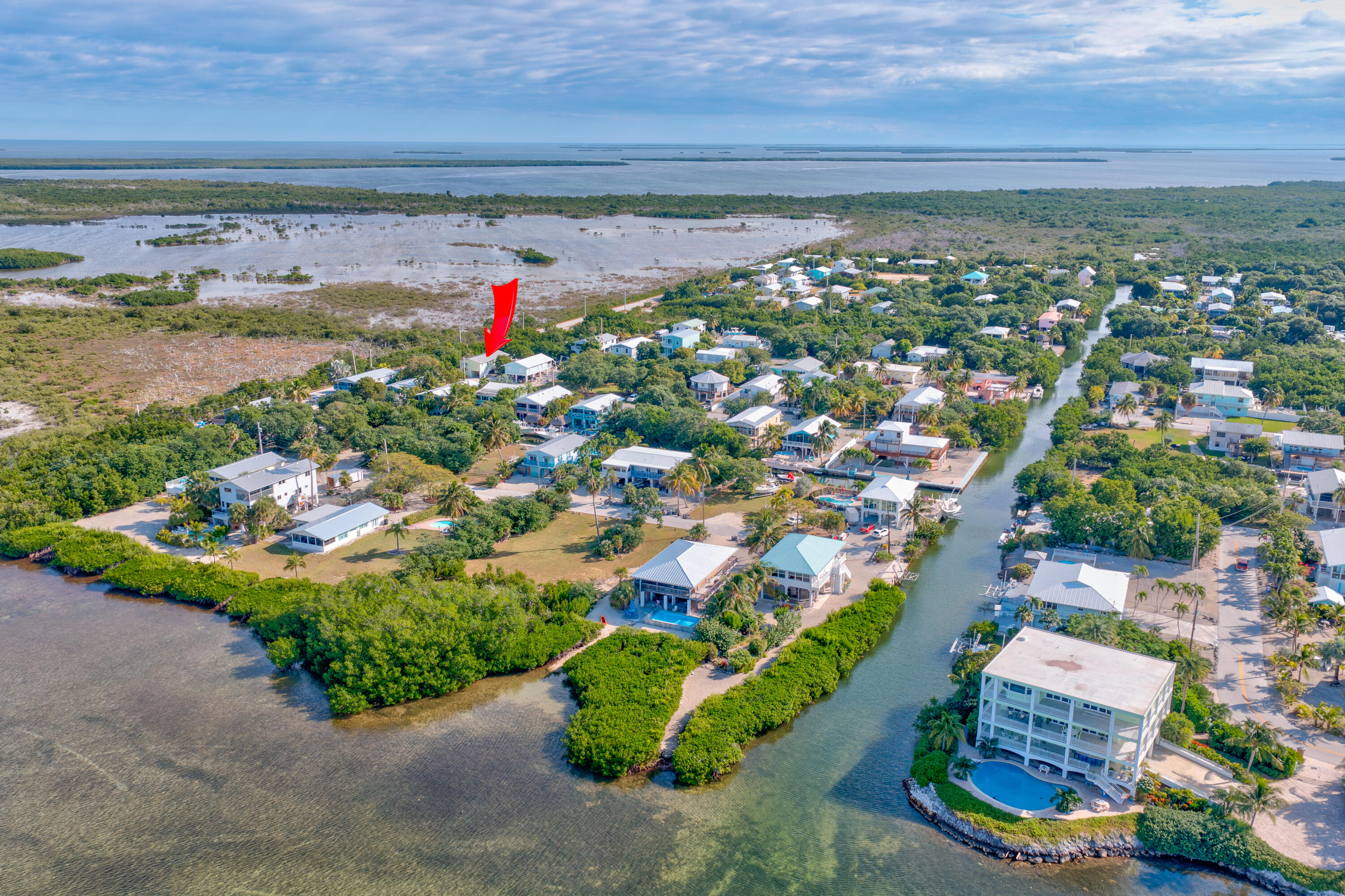 3987 Gordon Road Big Pine Key, FL 33043 - Photo 2 of 49 an aerial view of a house with a yard and lake view