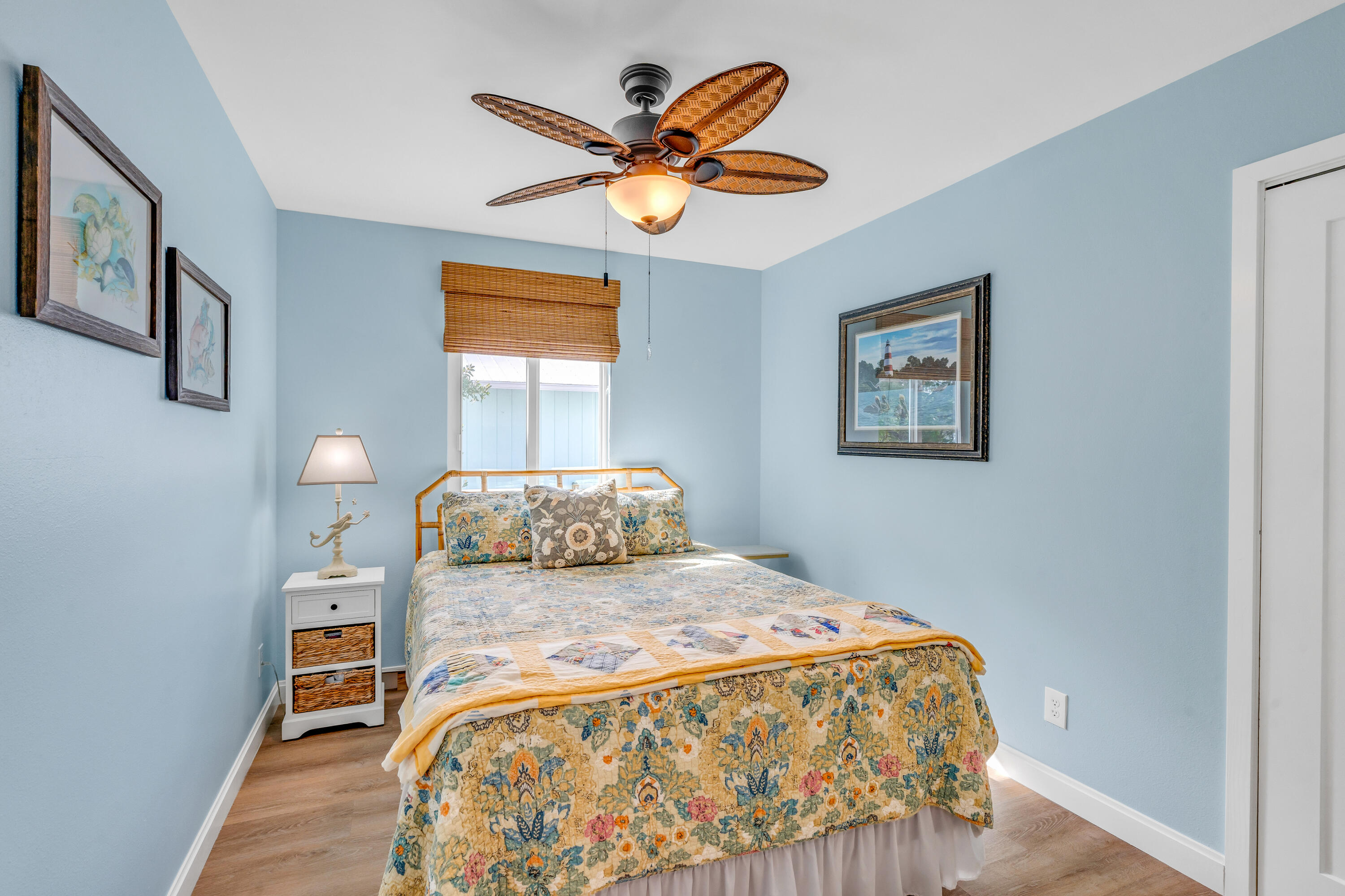 3987 Gordon Road Big Pine Key, FL 33043 - Photo 24 of 49 a bedroom with a bed and a chandelier