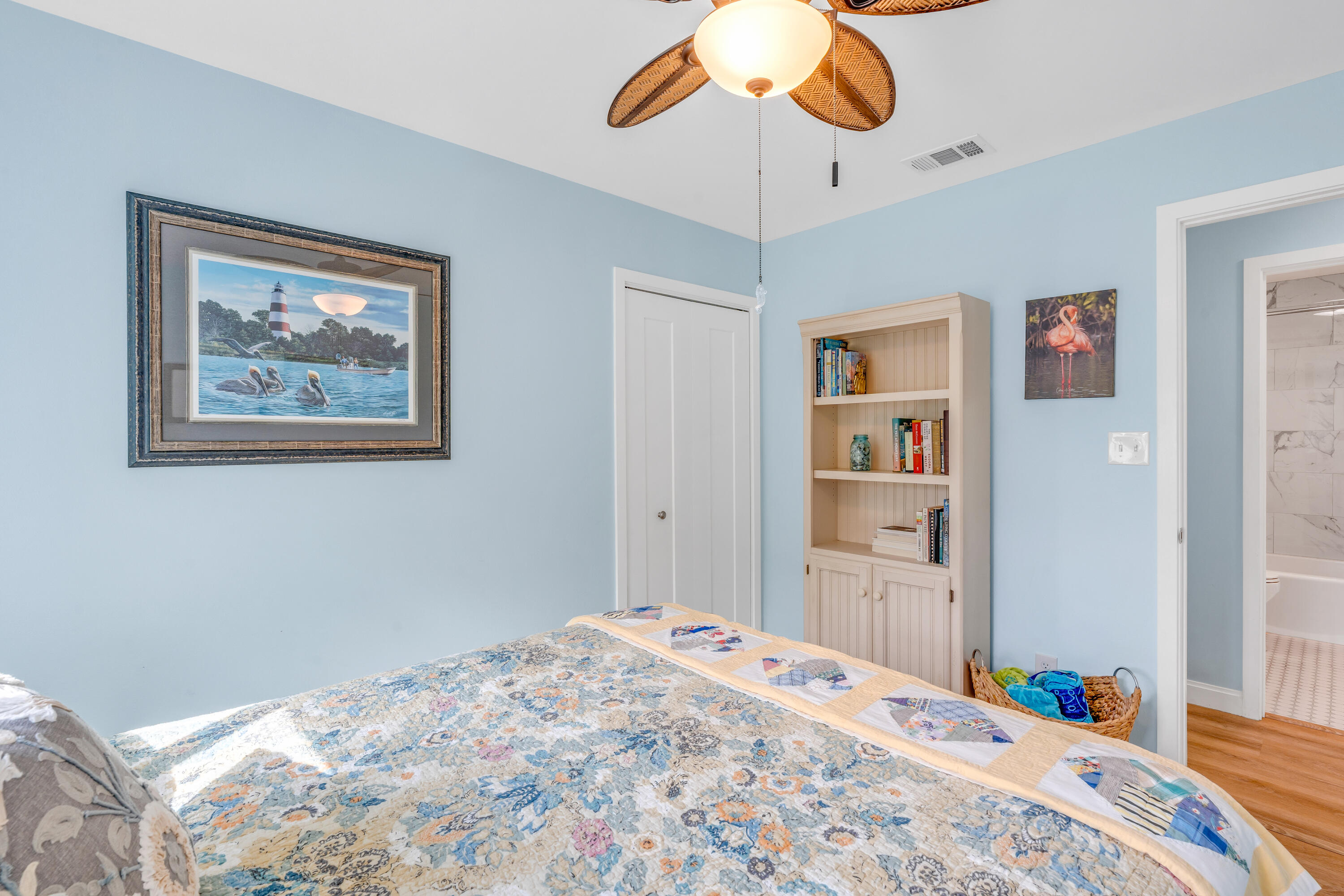 3987 Gordon Road Big Pine Key, FL 33043 - Photo 25 of 49 a bedroom with a bed and a chandelier