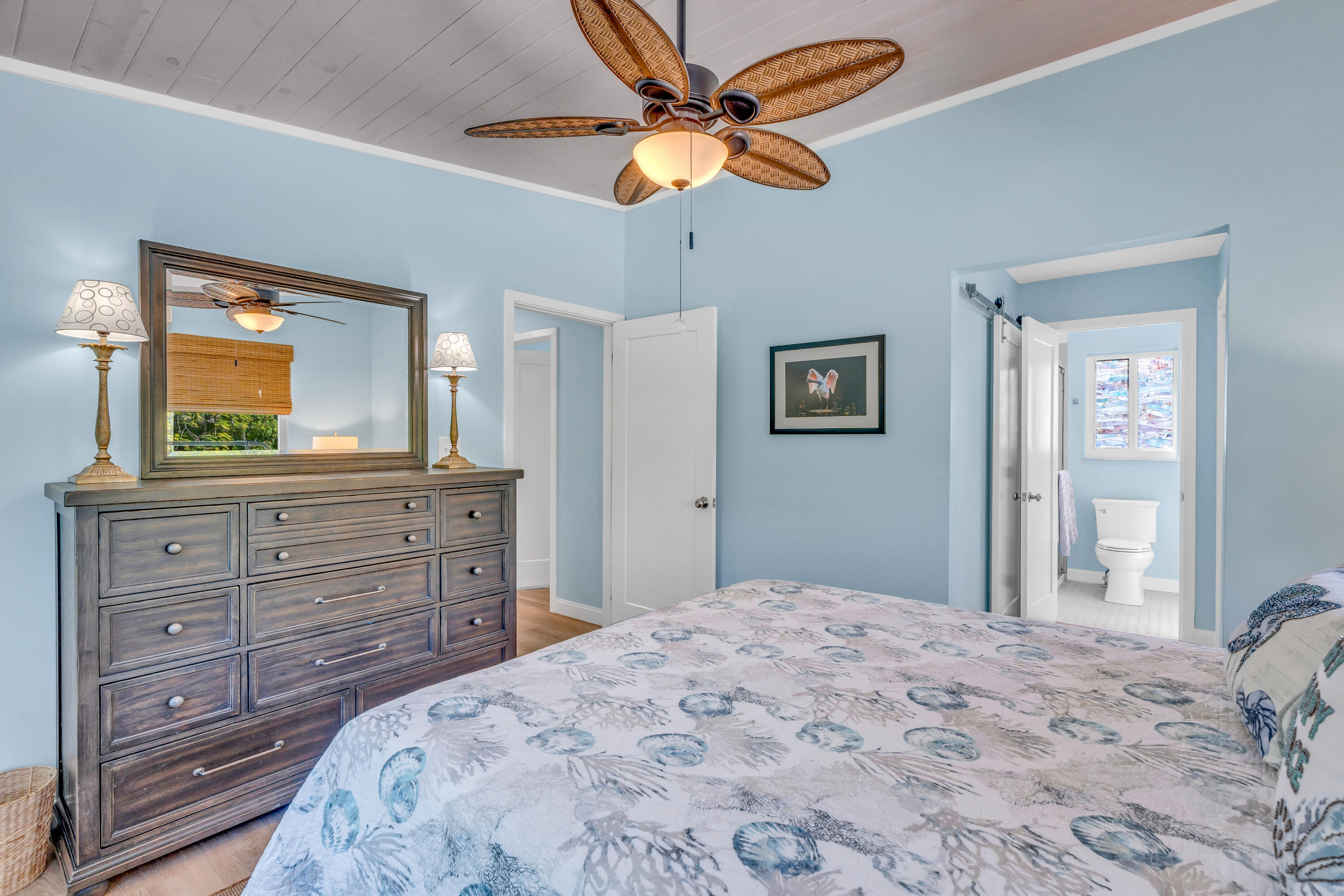 3987 Gordon Road Big Pine Key, FL 33043 - Photo 27 of 49 a bedroom with a bed and a dresser