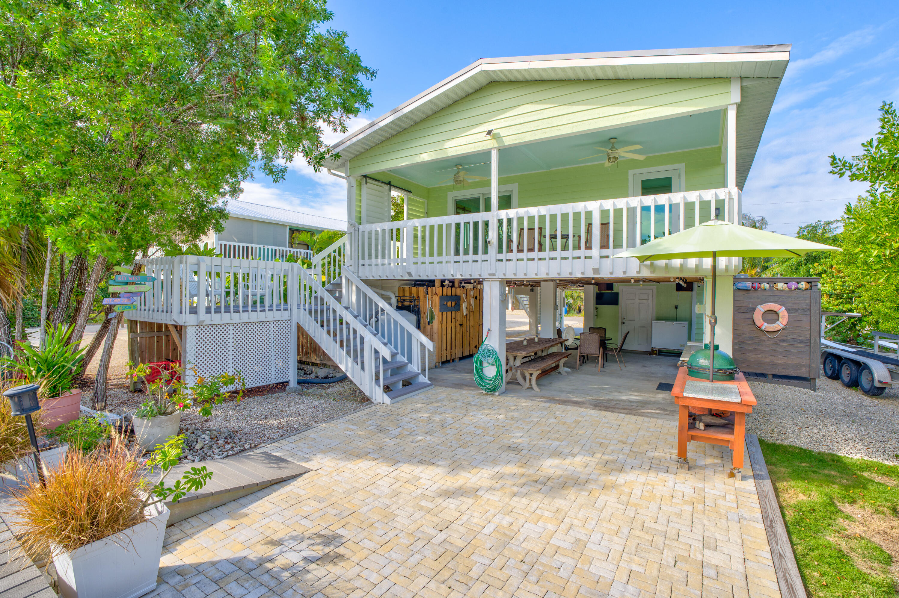 3987 Gordon Road Big Pine Key, FL 33043 - Photo 33 of 49 a view of a chair and table in the patio in front of house