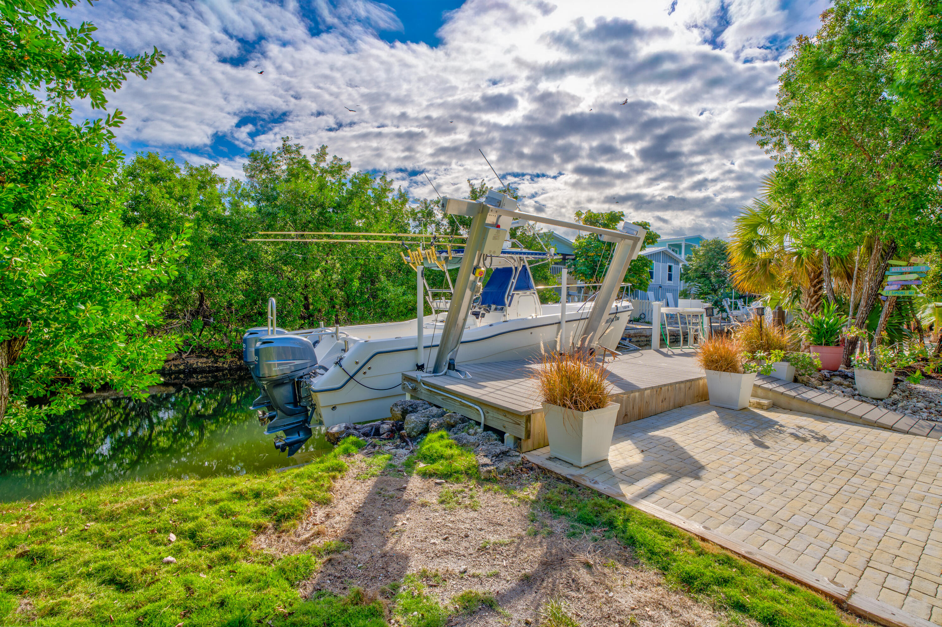 3987 Gordon Road Big Pine Key, FL 33043 - Photo 38 of 49 a view of a patio with chairs and a table