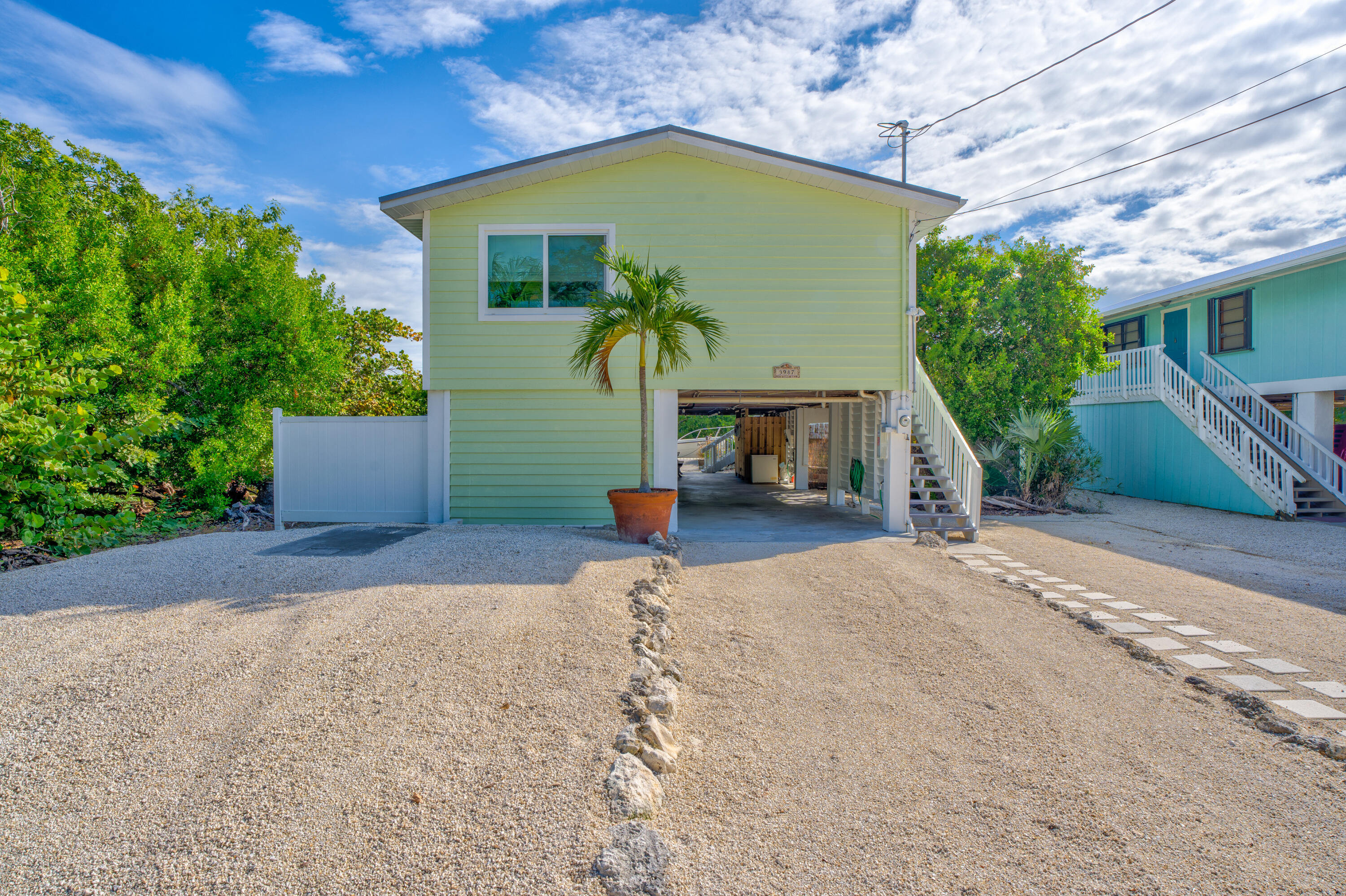 3987 Gordon Road Big Pine Key, FL 33043 - Photo 4 of 49 a view of a house with a patio