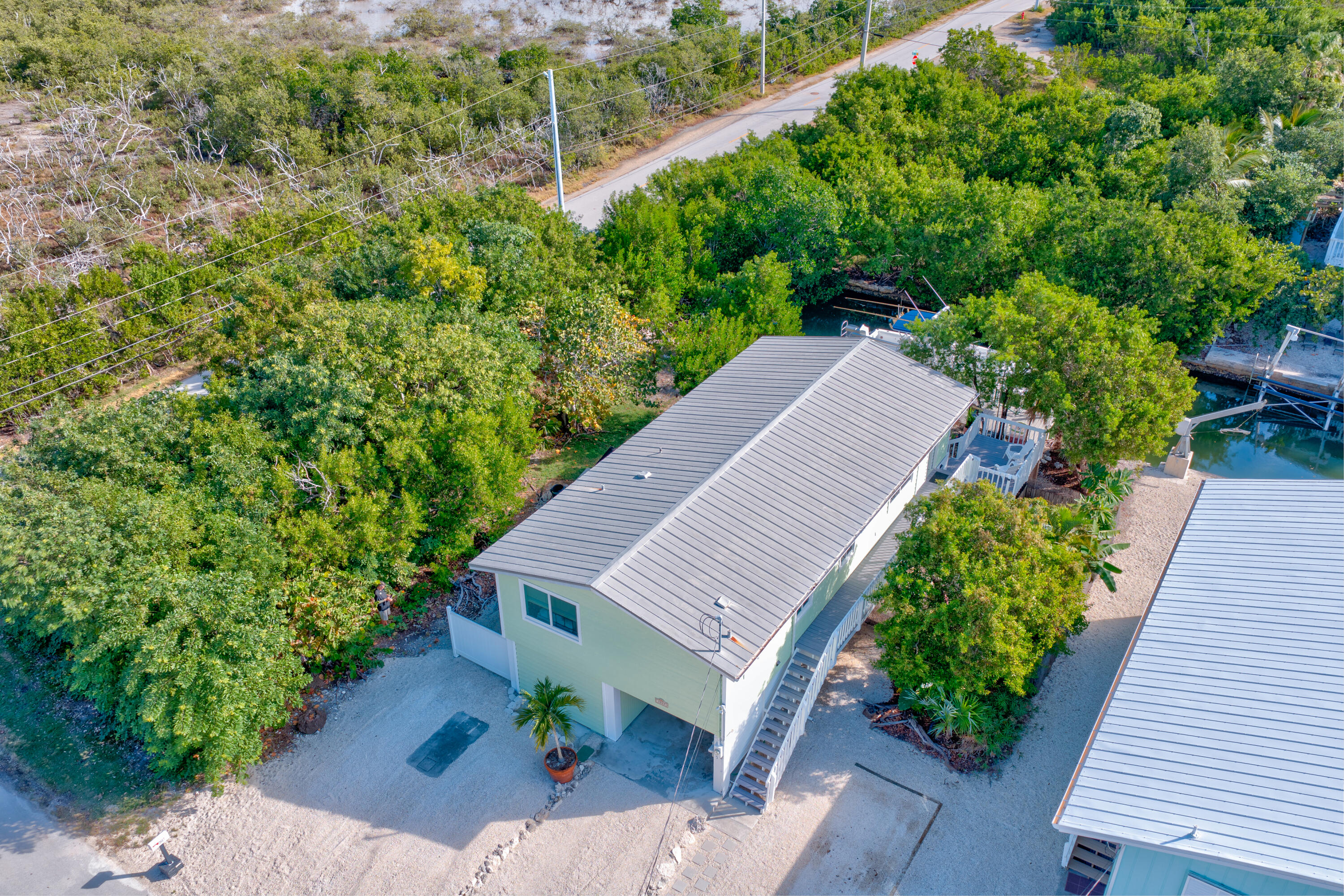 3987 Gordon Road Big Pine Key, FL 33043 - Photo 43 of 49 an aerial view of a house with a yard and potted plants