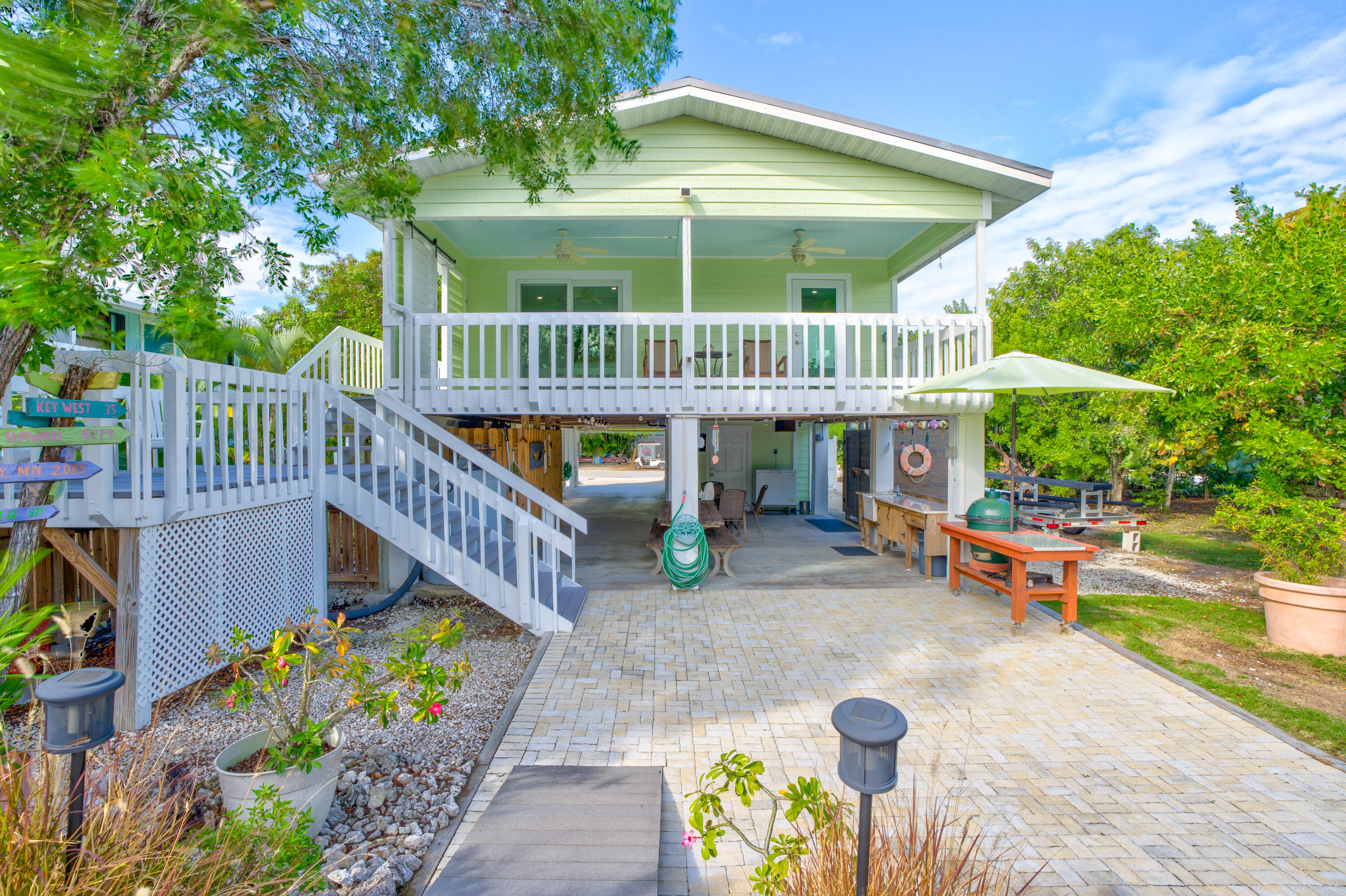 3987 Gordon Road Big Pine Key, FL 33043 - Photo 6 of 49 a view of a patio with a table and chairs