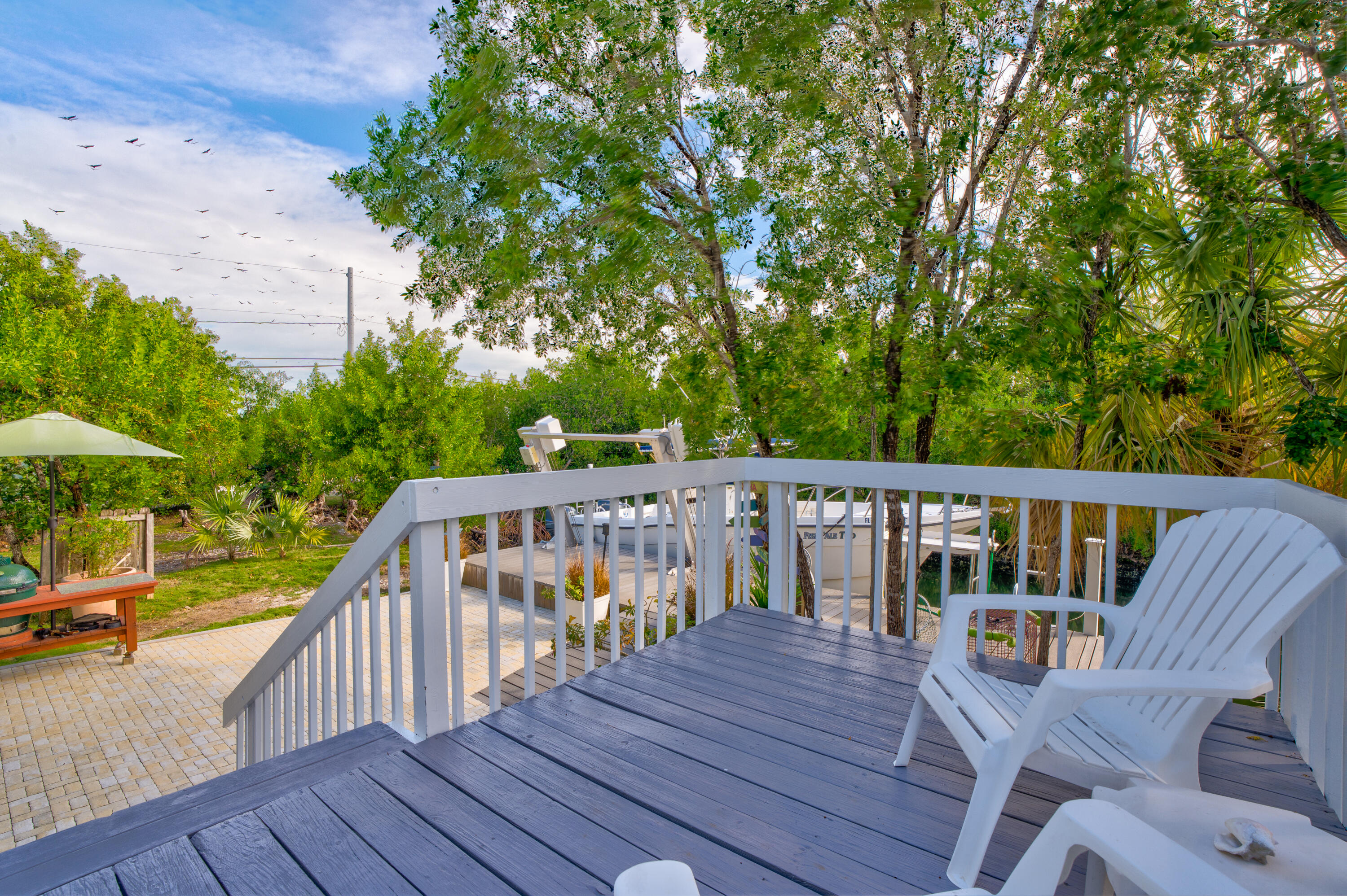 3987 Gordon Road Big Pine Key, FL 33043 - Photo 10 of 49 a view of balcony with furniture and trees