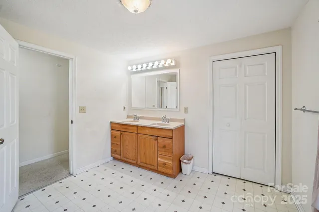 a bathroom with a shower and a mirror