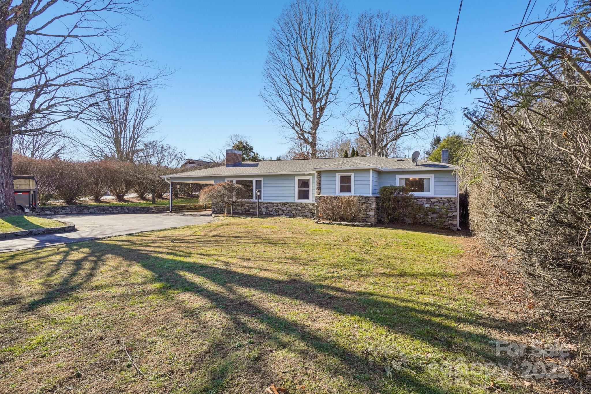 511 Oak Grove Road Flat Rock, NC 28731 - Photo 4 of 34 a view of house with outdoor space and swimming pool