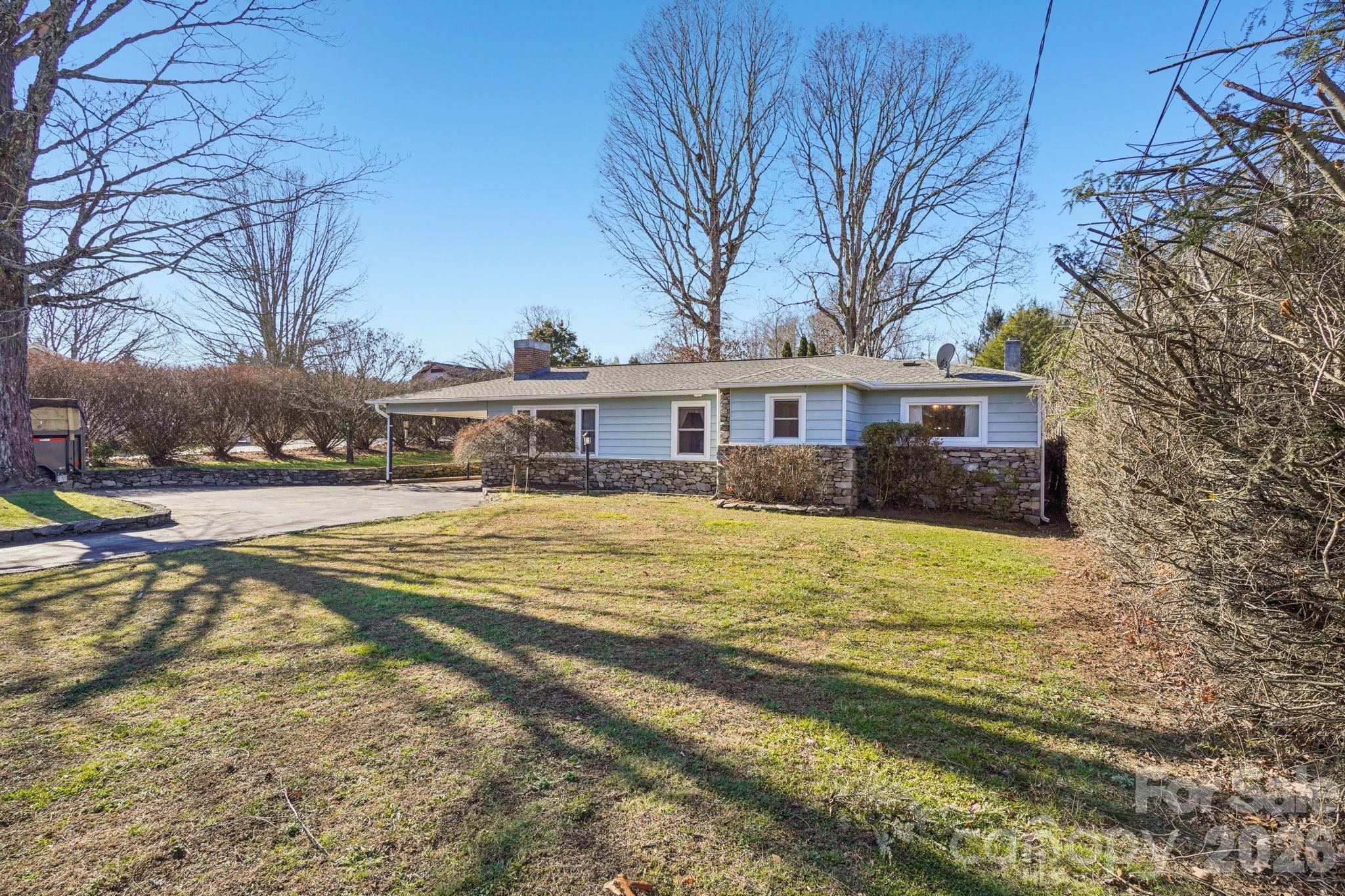 511 Oak Grove Road Flat Rock, NC 28731 - Photo 4 of 38 a view of house with outdoor space and swimming pool