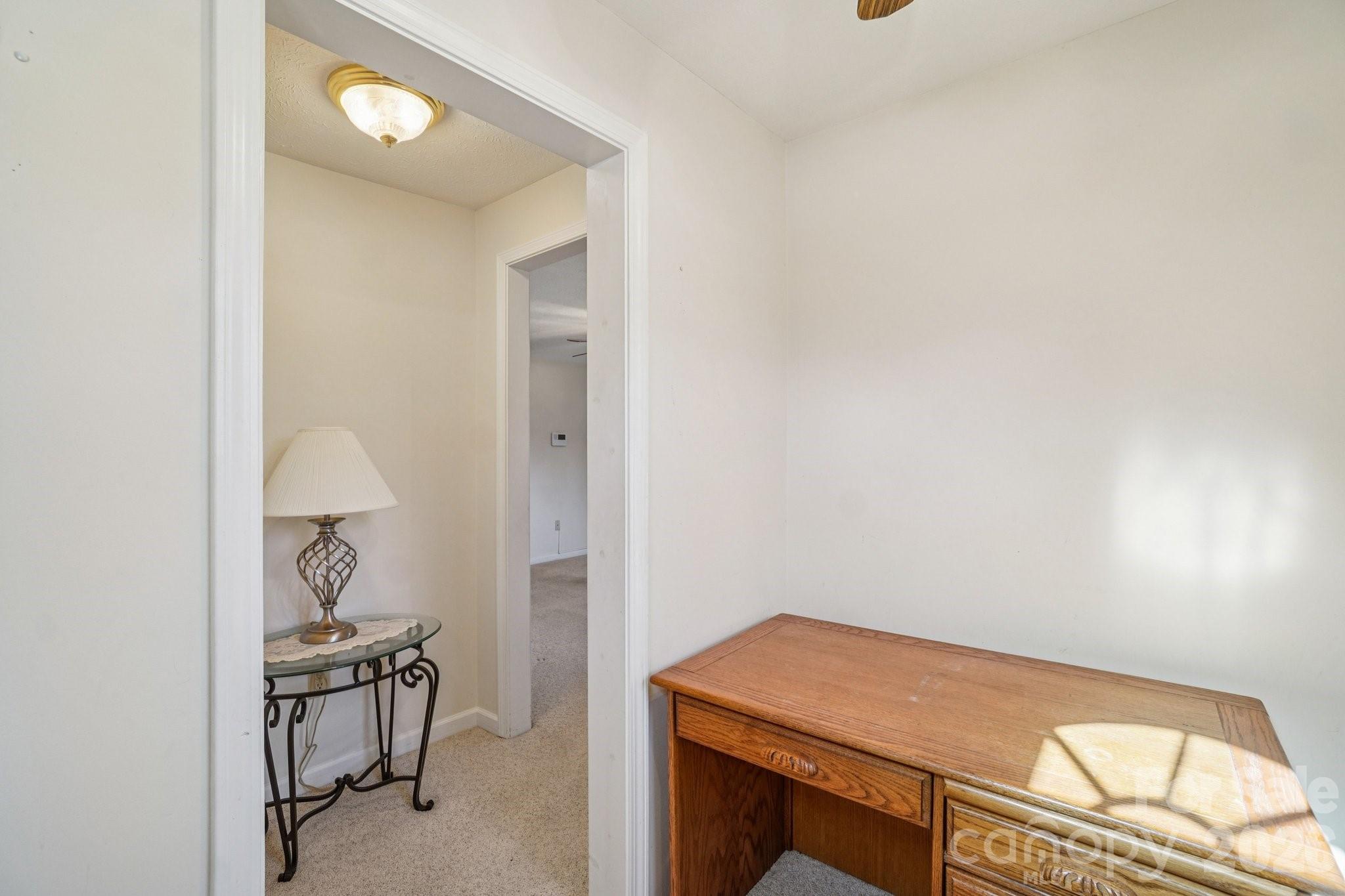 511 Oak Grove Road Flat Rock, NC 28731 - Photo 7 of 38 a room that has a bed and a table in it