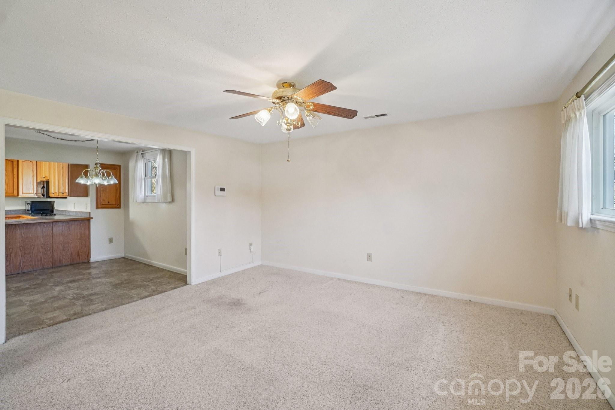 511 Oak Grove Road Flat Rock, NC 28731 - Photo 8 of 38 wooden floor in an empty room with a window