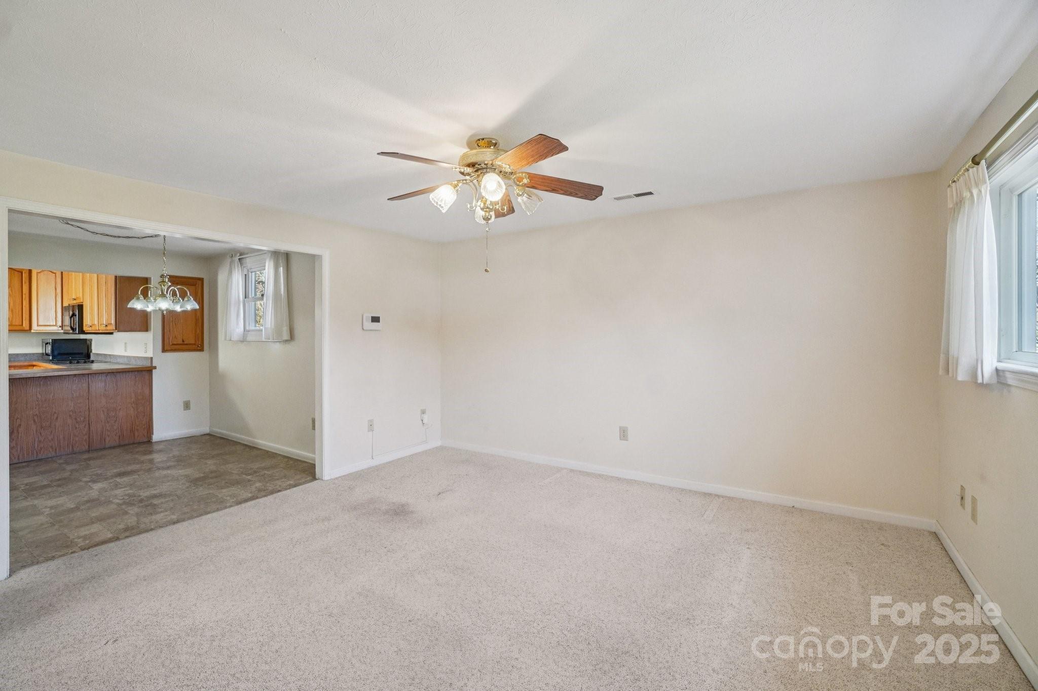 511 Oak Grove Road Flat Rock, NC 28731 - Photo 8 of 34 wooden floor in an empty room with a window