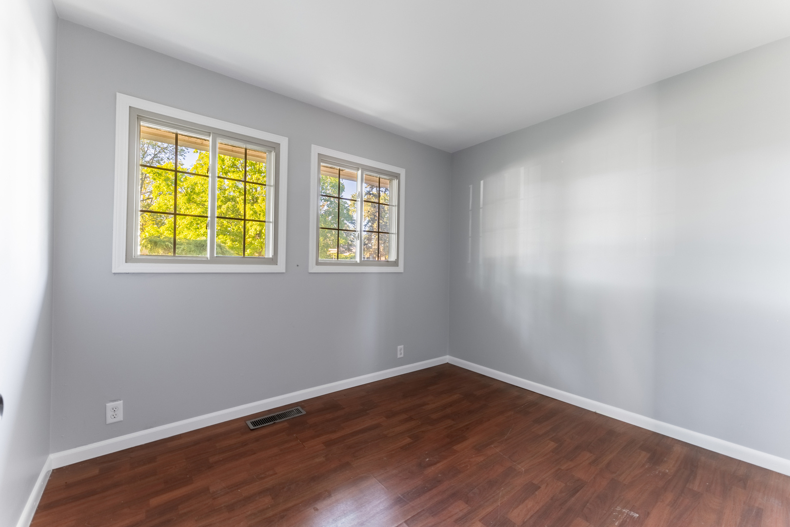435 Douglas Road Batavia, IL 60510 - Photo 16 of 24 a view of an empty room with wooden floor and a window