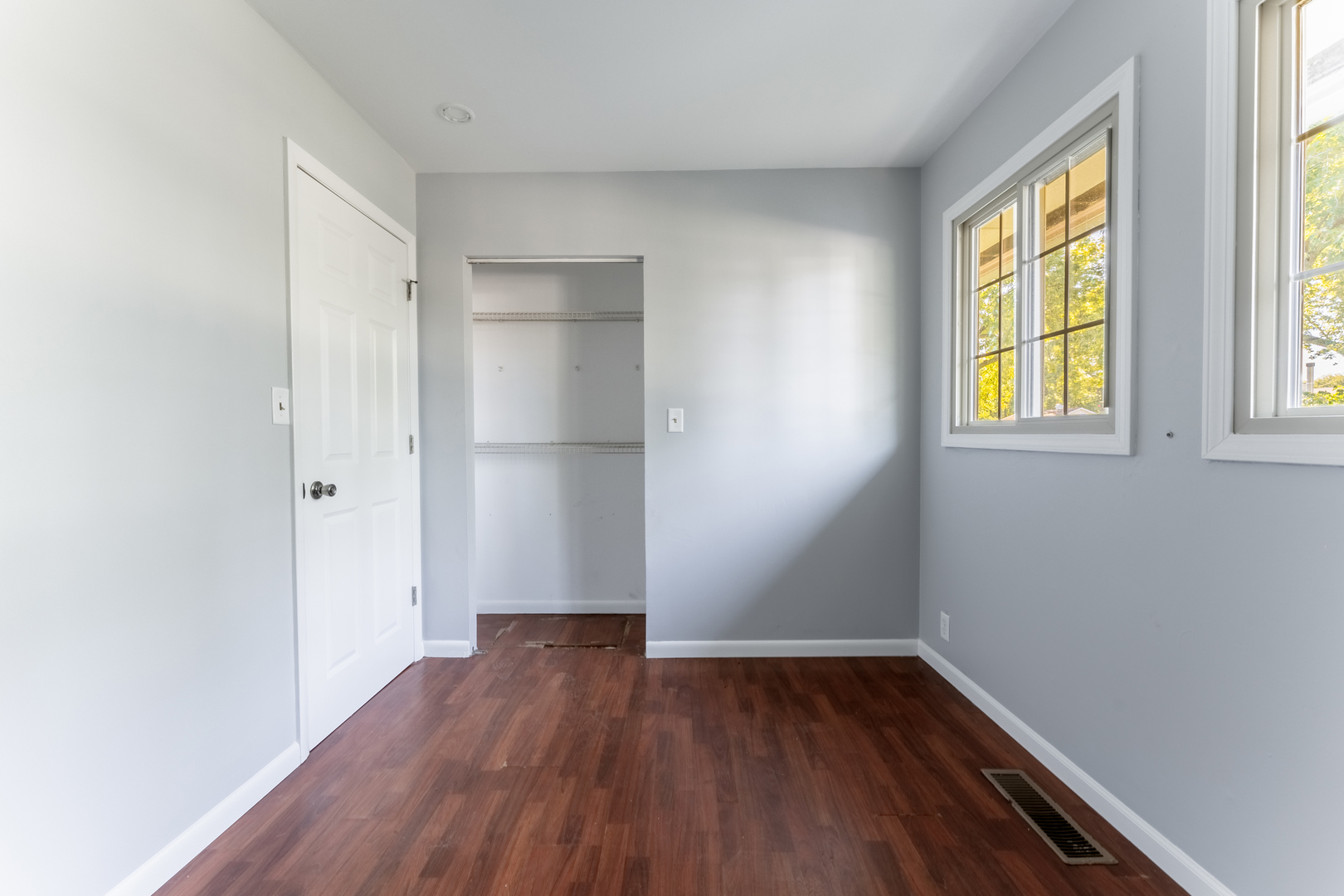 435 Douglas Road Batavia, IL 60510 - Photo 17 of 24 an empty room with wooden floor and windows