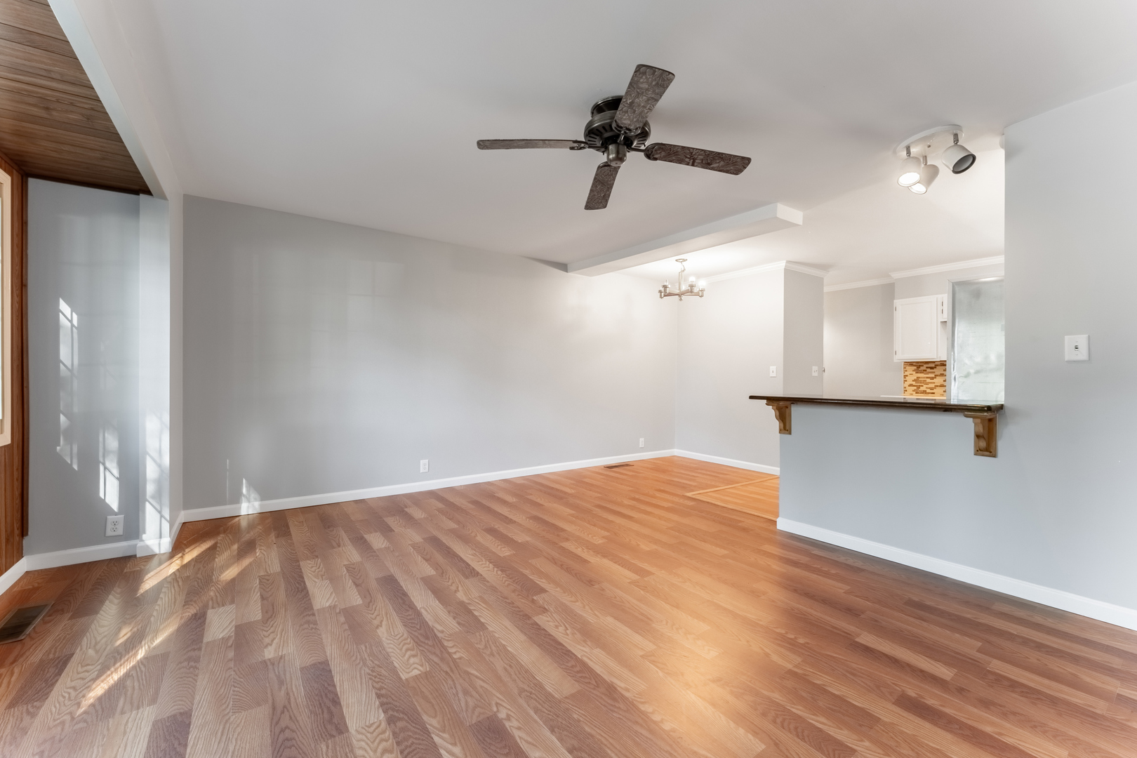 435 Douglas Road Batavia, IL 60510 - Photo 4 of 24 a view of empty room with wooden floor and ceiling fan