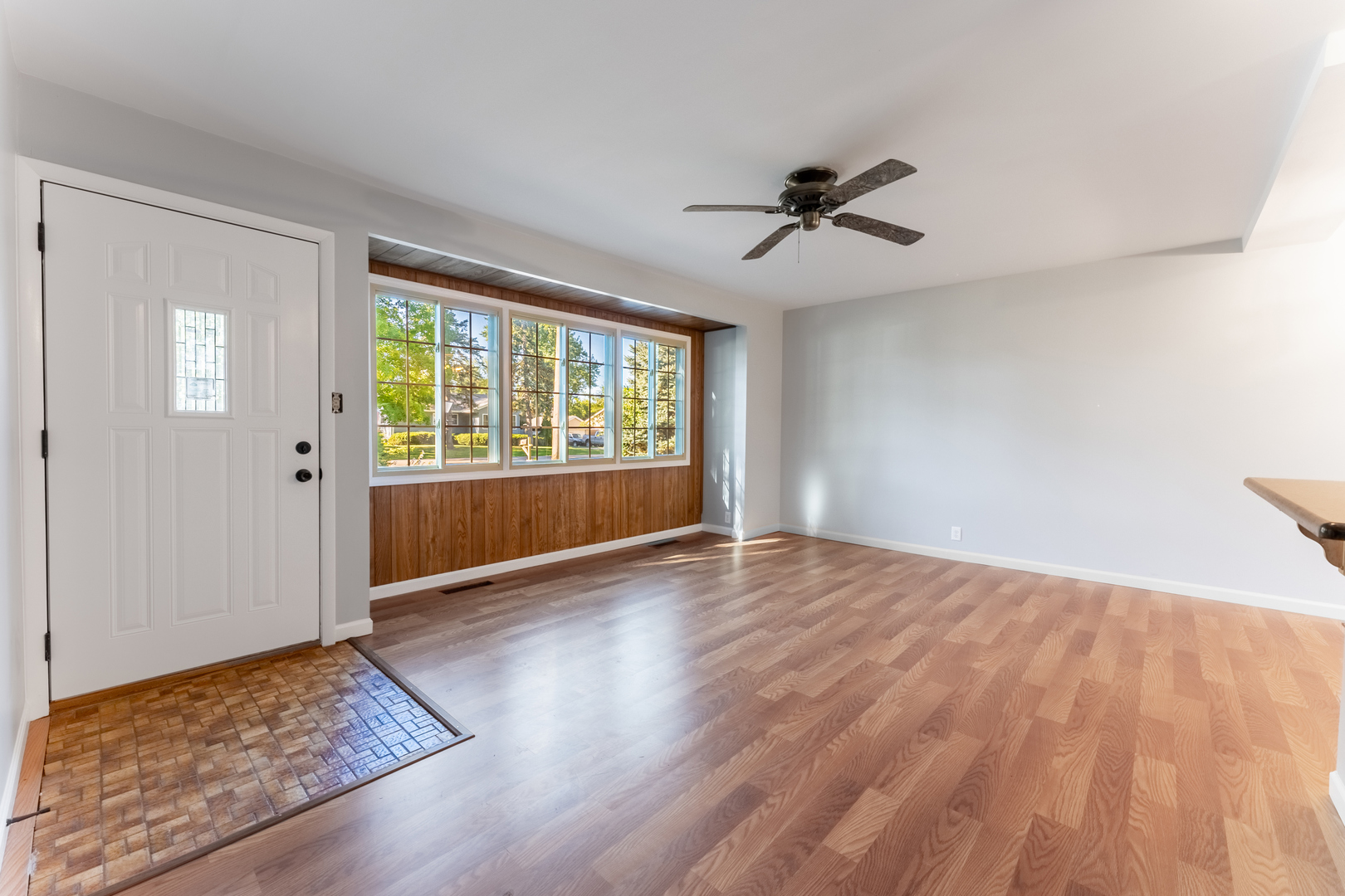 435 Douglas Road Batavia, IL 60510 - Photo 5 of 24 a view of empty room with wooden floor and fan