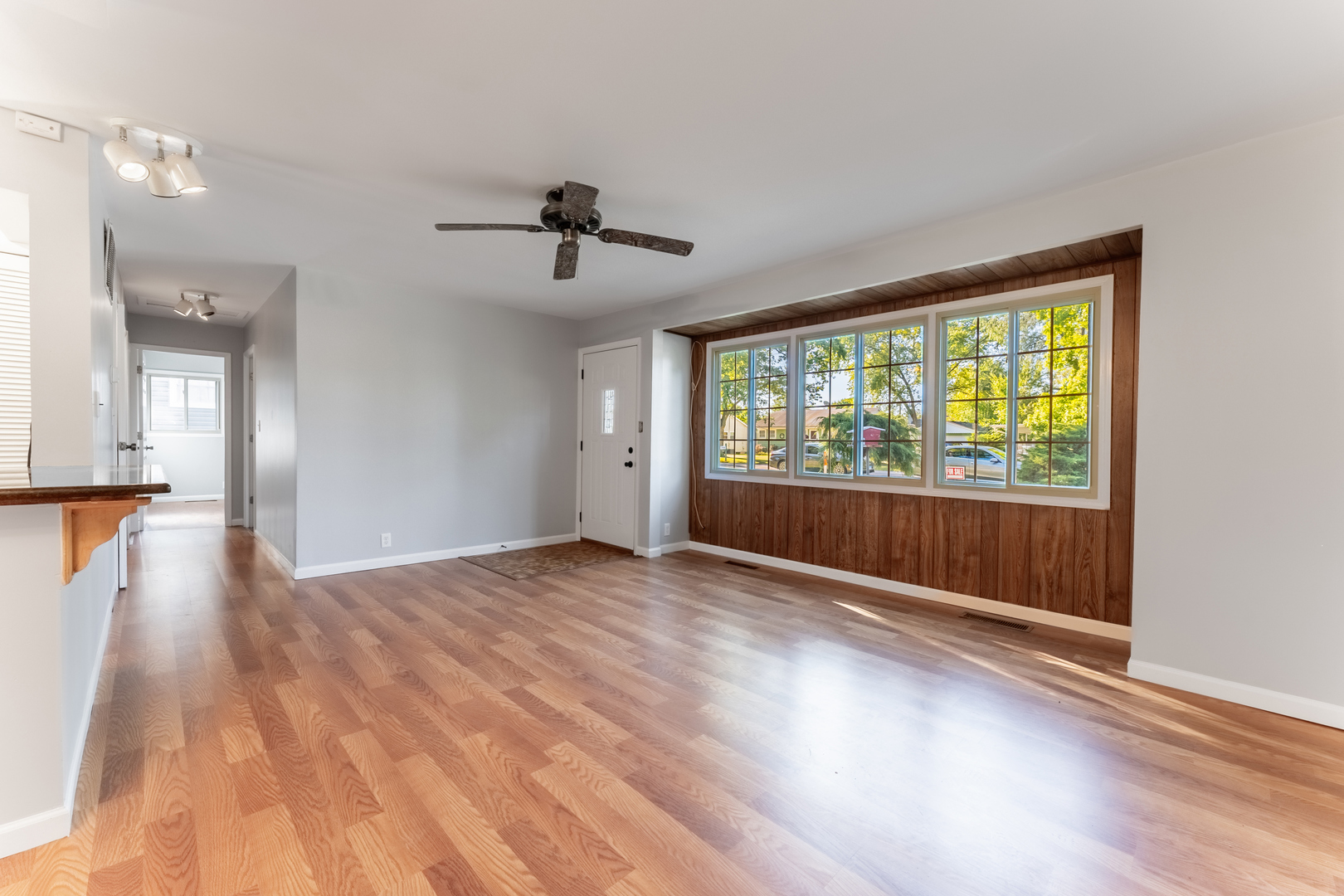 435 Douglas Road Batavia, IL 60510 - Photo 6 of 24 a view of empty room with wooden floor and fan