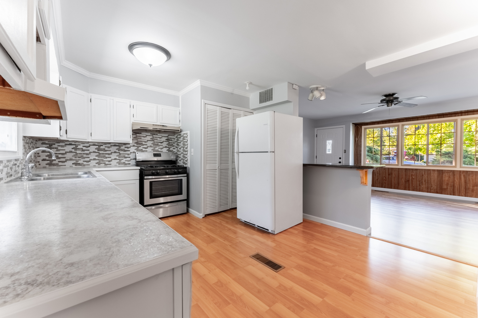 435 Douglas Road Batavia, IL 60510 - Photo 10 of 24 a kitchen with stainless steel appliances granite countertop a refrigerator a stove and a sink
