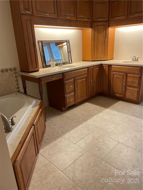69 Towhee Trail Tryon, NC 28782 - Photo 14 of 20 a kitchen with a sink and cabinets