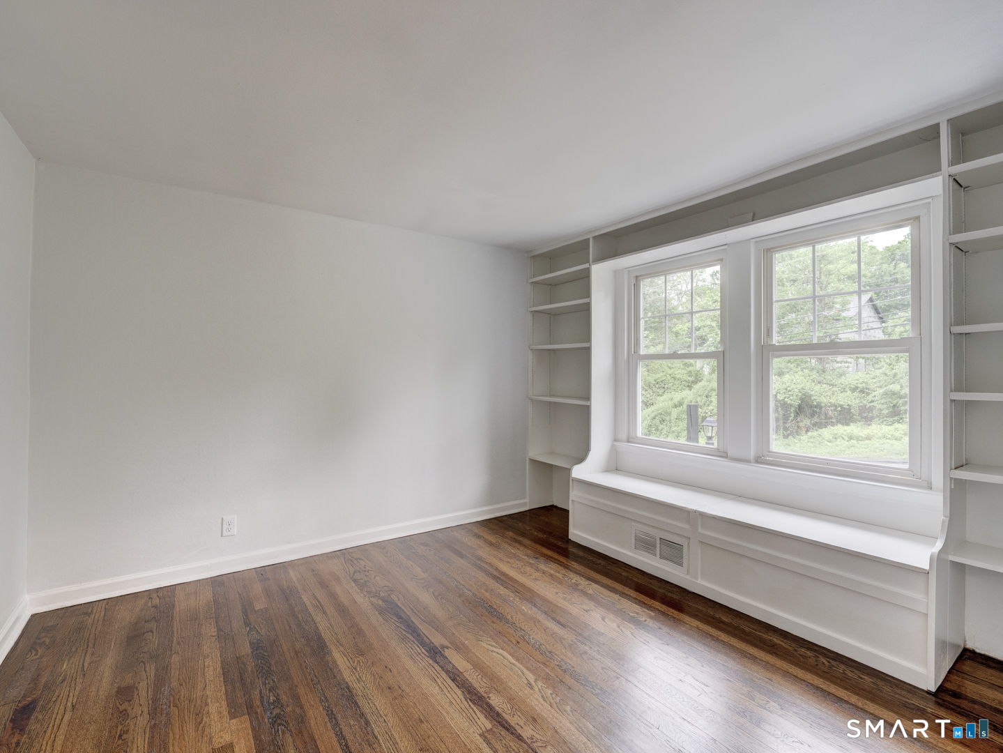 11 Cheshire Road Prospect, CT 06712 - Photo 18 of 38 an empty room with wooden floor and windows