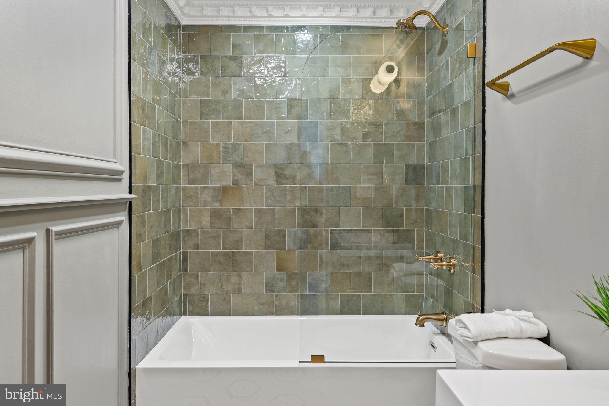 914 Fernon Street Philadelphia, PA 19148 - Photo 16 of 40 a bathroom with a bathtub and a shower