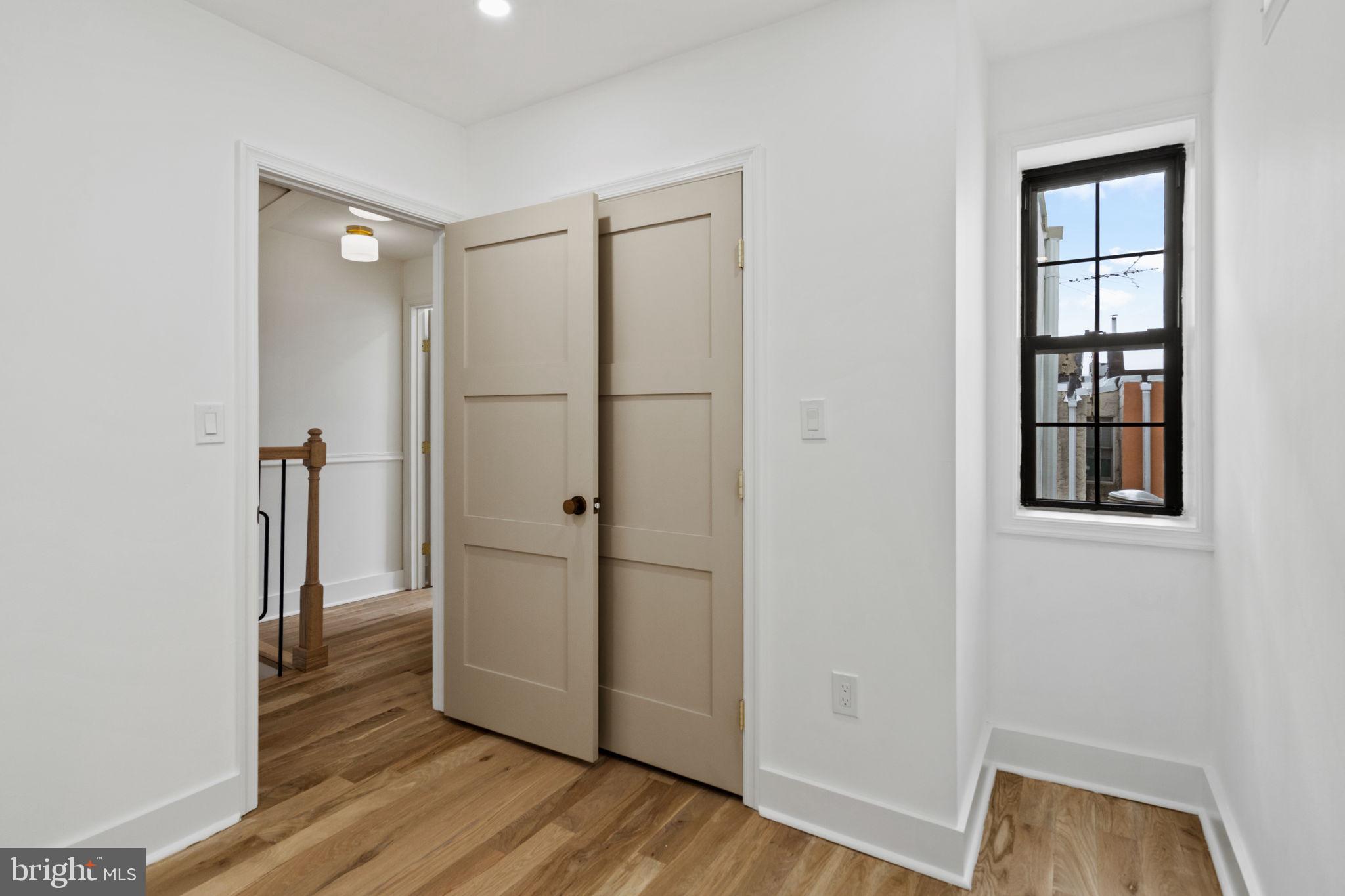 914 Fernon Street Philadelphia, PA 19148 - Photo 18 of 40 an empty room with wooden floor and closet