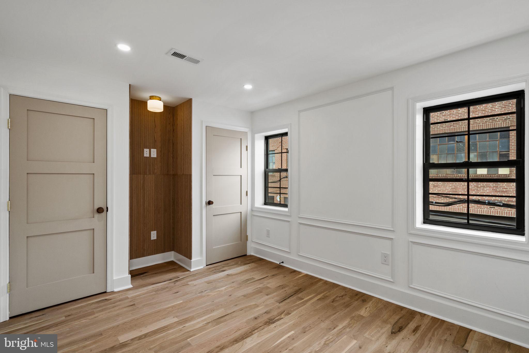 914 Fernon Street Philadelphia, PA 19148 - Photo 22 of 40 wooden floor in an empty room with a window