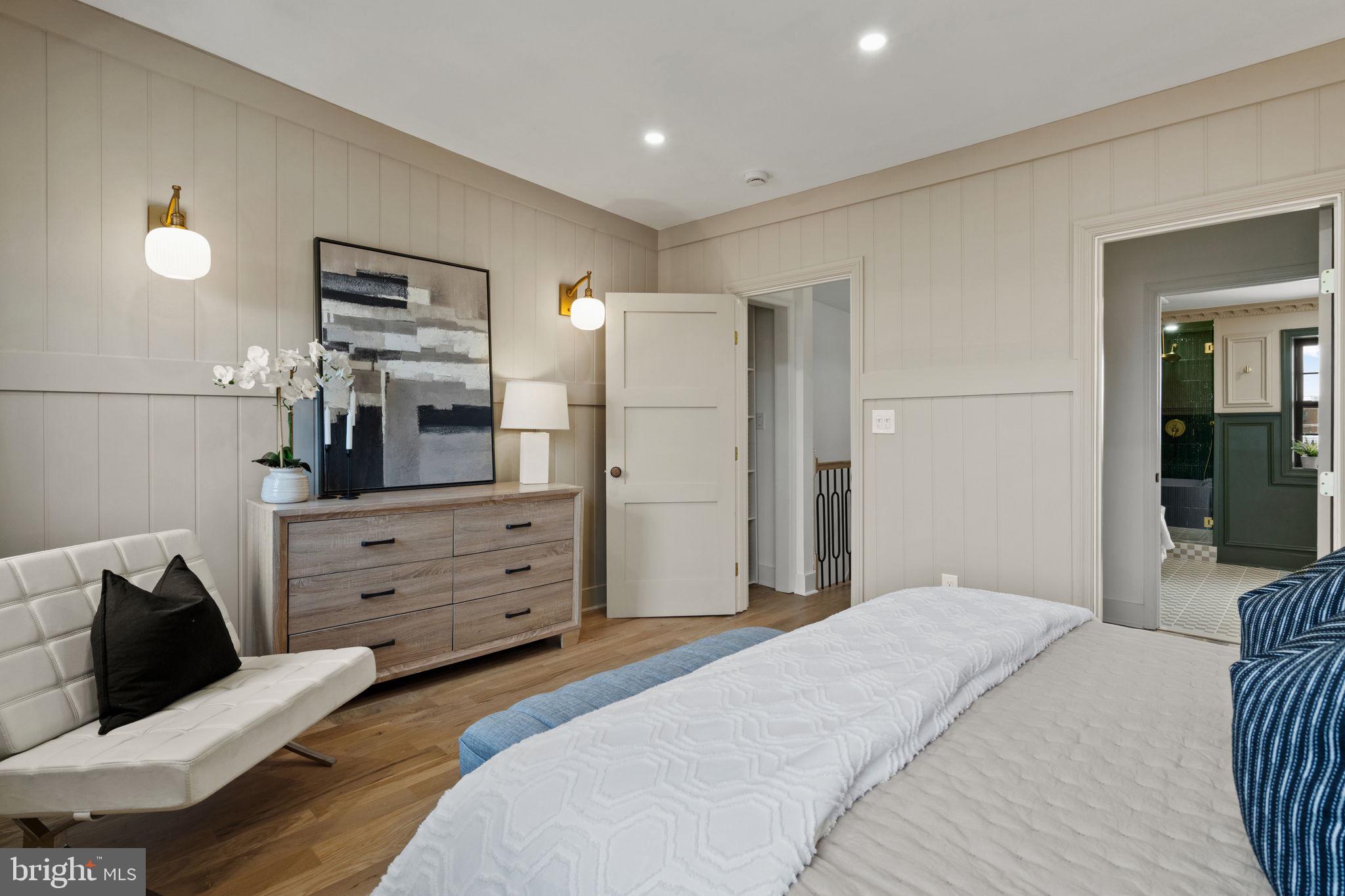 914 Fernon Street Philadelphia, PA 19148 - Photo 27 of 40 a bedroom with a bed and wooden floor