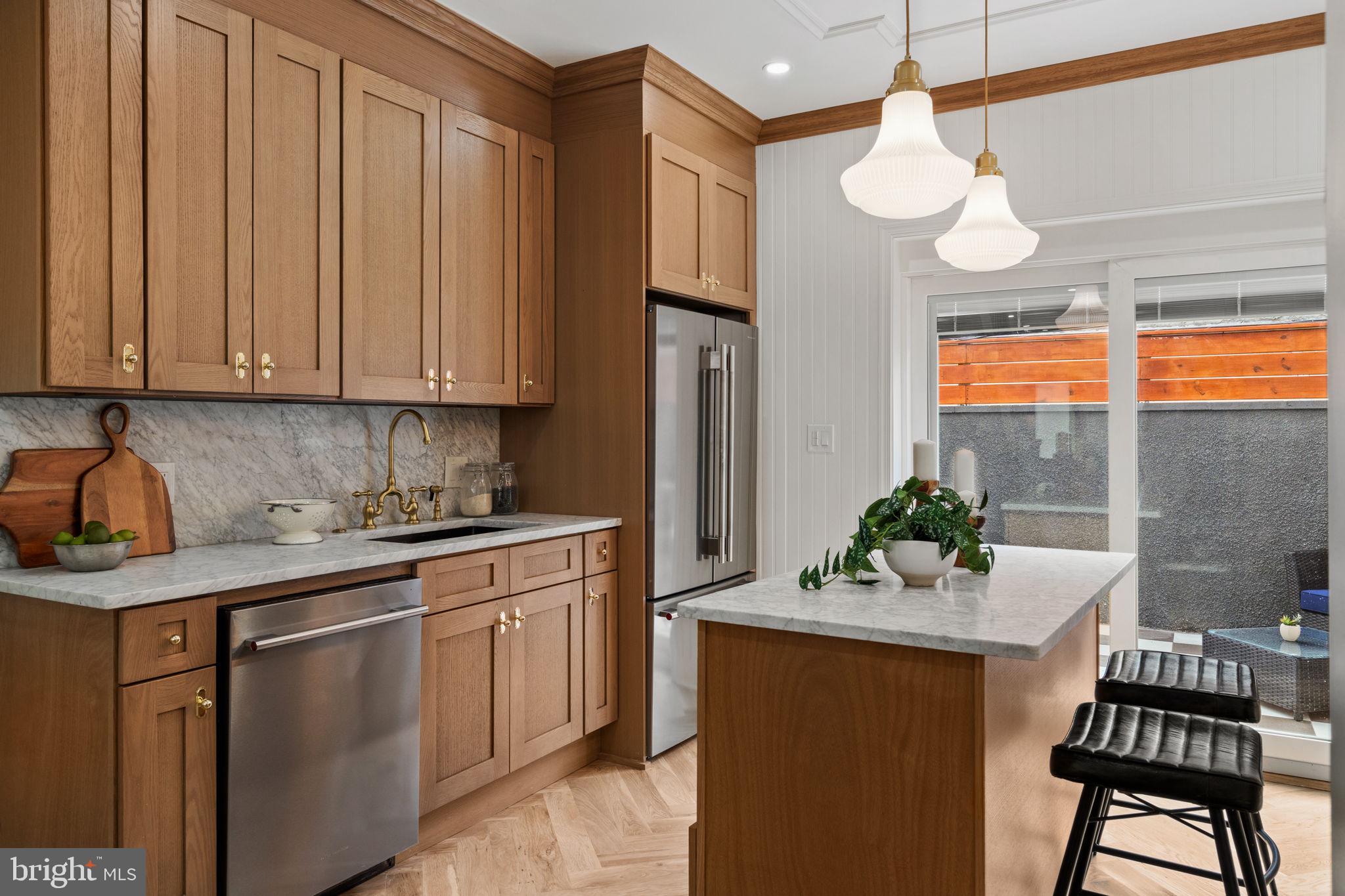 914 Fernon Street Philadelphia, PA 19148 - Photo 3 of 40 a kitchen with a sink cabinets and window