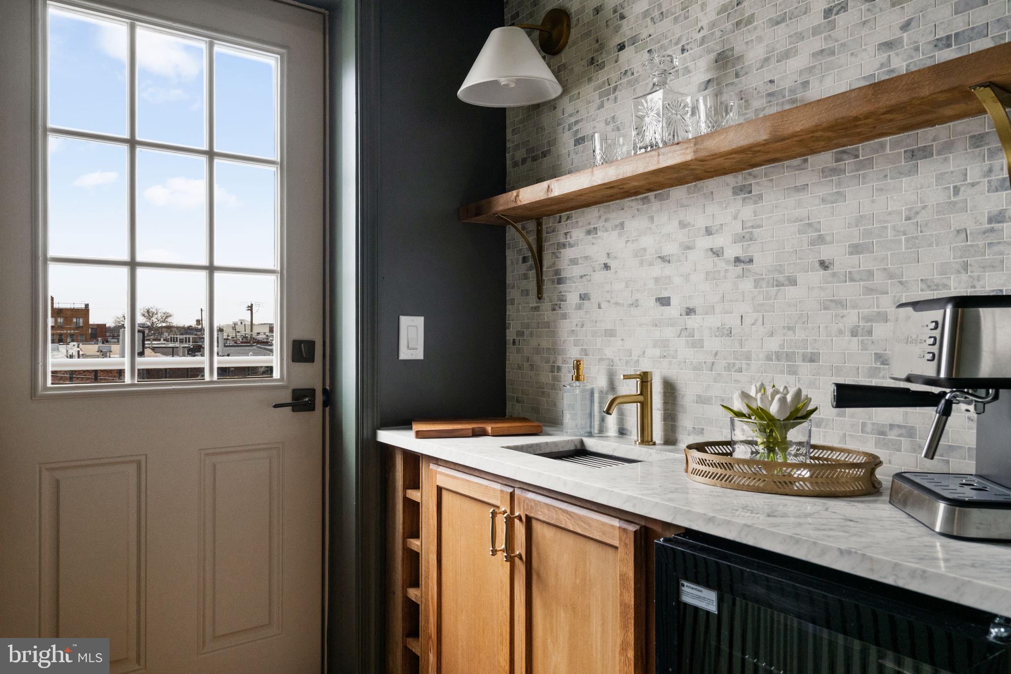 914 Fernon Street Philadelphia, PA 19148 - Photo 32 of 40 a bathroom with a sink a mirror and a toilet