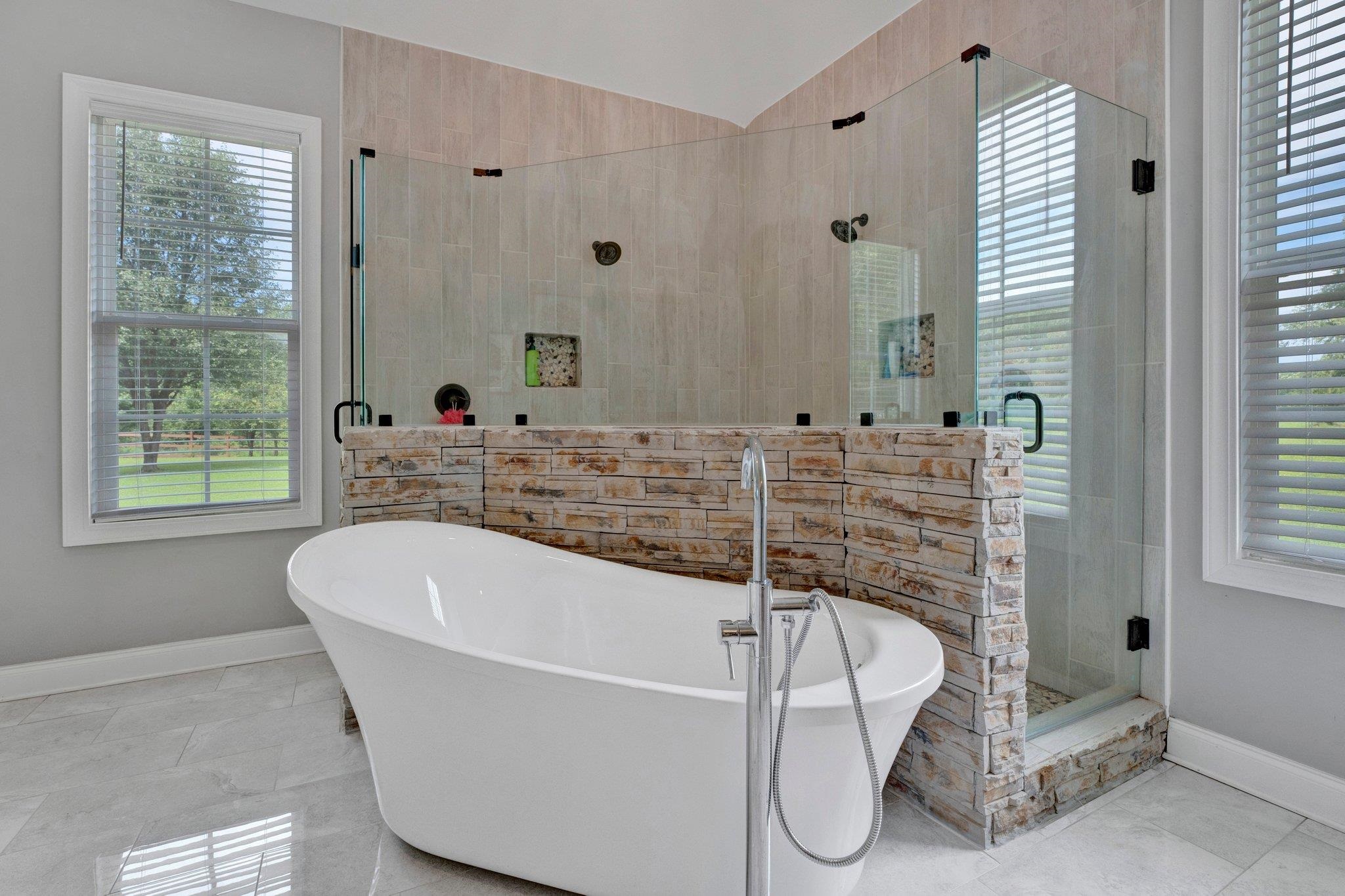 3270 Rast Road Millington, TN 38053 - Photo 27 of 40 Bathroom with a freestanding bath, a shower stall, vaulted ceiling, and tile patterned flooring