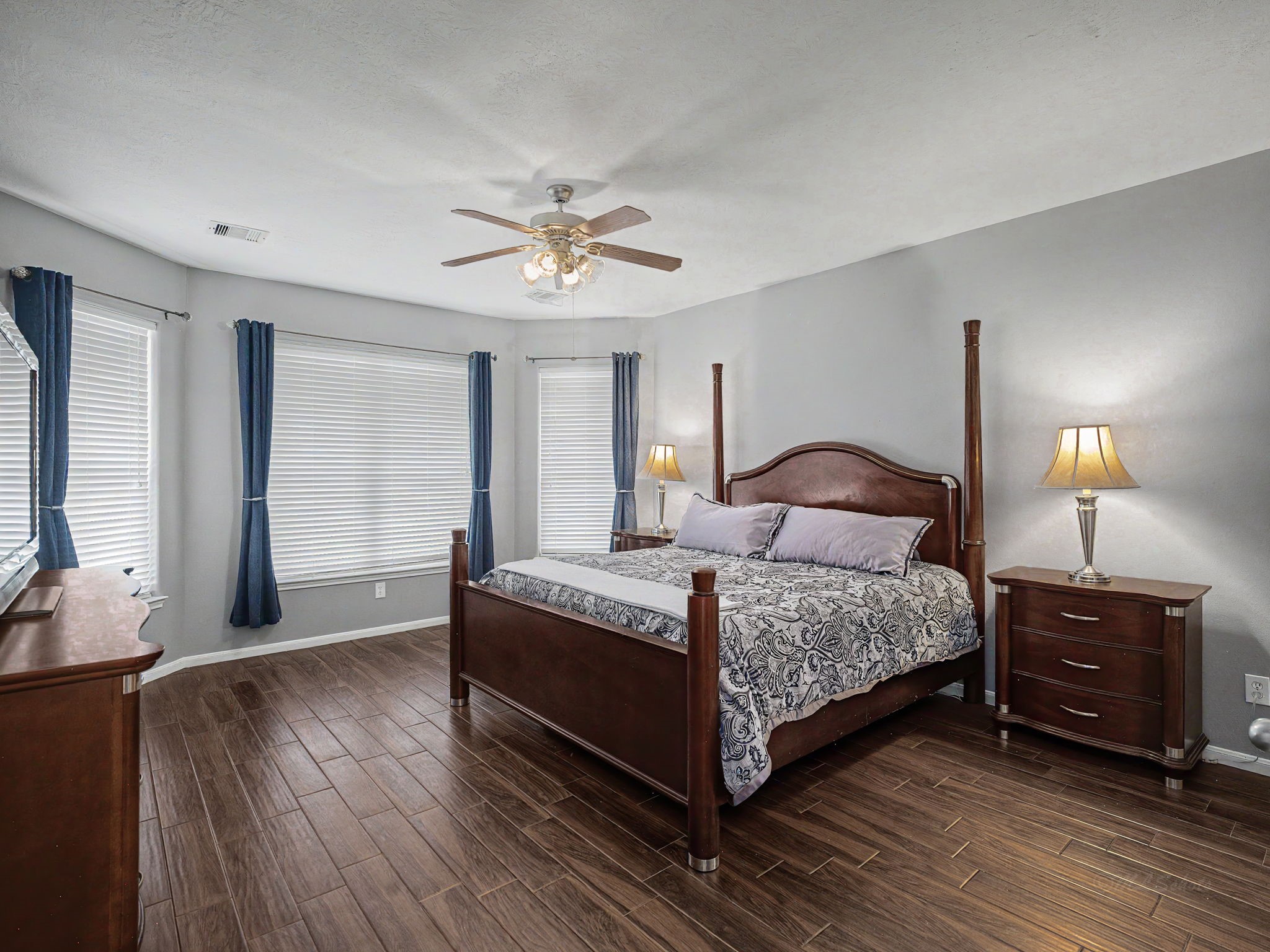 2210 Fox Path Katy, TX 77494 - Photo 25 of 47 This expansive first-floor primary bedroom serves as a quiet, private sanctuary tucked away from the main living areas.
