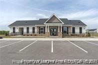 268 Brickhill Drive Raeford, NC 28376 - Photo 20 of 21 a front view of a building with a garden