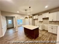268 Brickhill Drive Raeford, NC 28376 - Photo 3 of 21 a kitchen with kitchen island a sink counter top space and cabinets