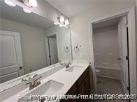 268 Brickhill Drive Raeford, NC 28376 - Photo 9 of 21 a bathroom with a sink vanity and a mirror