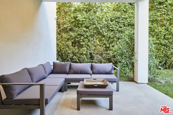 a outdoor living space with furniture and a potted plant