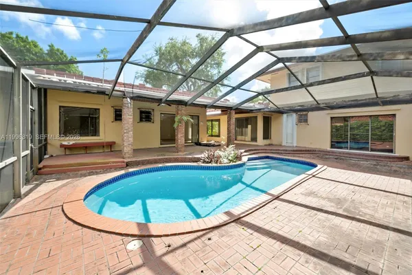 a view of a swimming pool with a patio