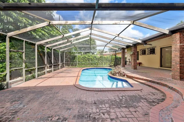 a view of a backyard with a wooden deck
