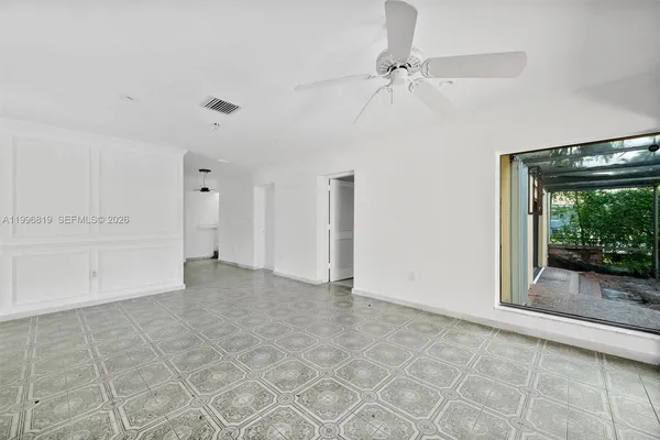 a view of an empty room with a window