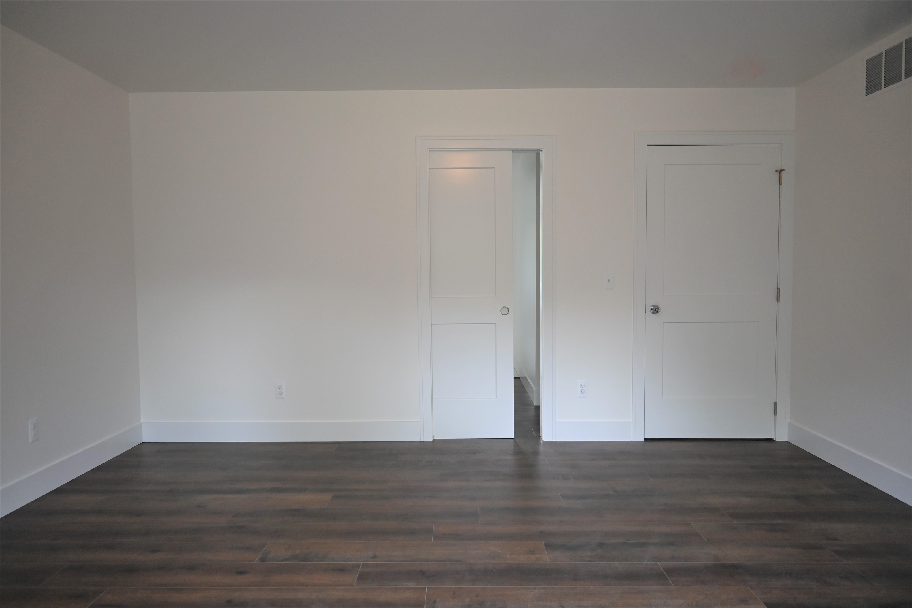 8821 Short Cut Road Fair Haven, MI 48023 - Photo 9 of 27 Master Bedroom - pocket door to hallway leading to walk-in closet, shower, water closet, soaking tub and double vanity