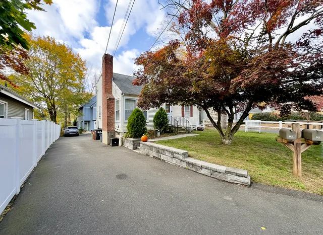 a view of a house with basketball court