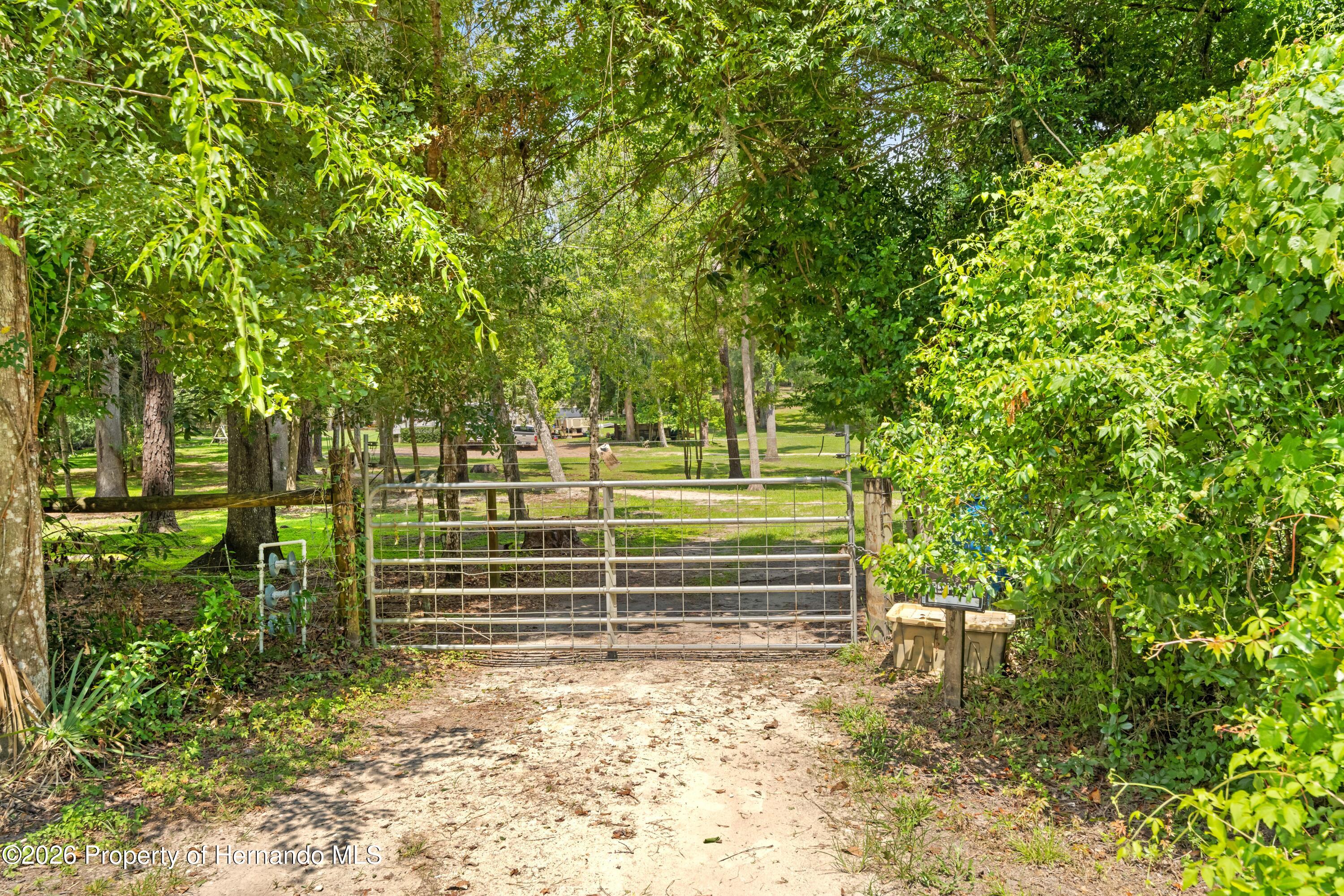 3311 Baseball Pond Road Brooksville, FL 34602 - Photo 2 of 18 a view of outdoor space with deck and tree