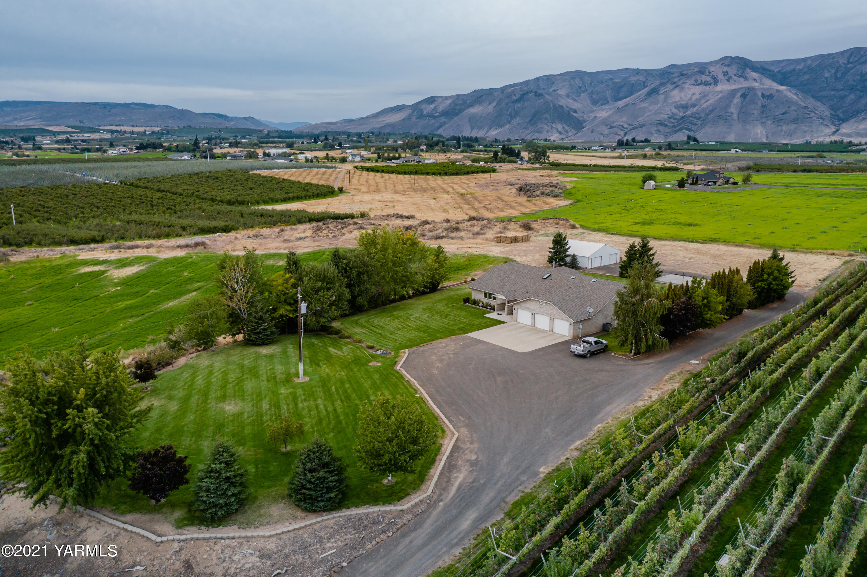 1511 Rosenkranz Road Tieton, WA 98947 - Photo 1 of 41 a view of a city with a lake