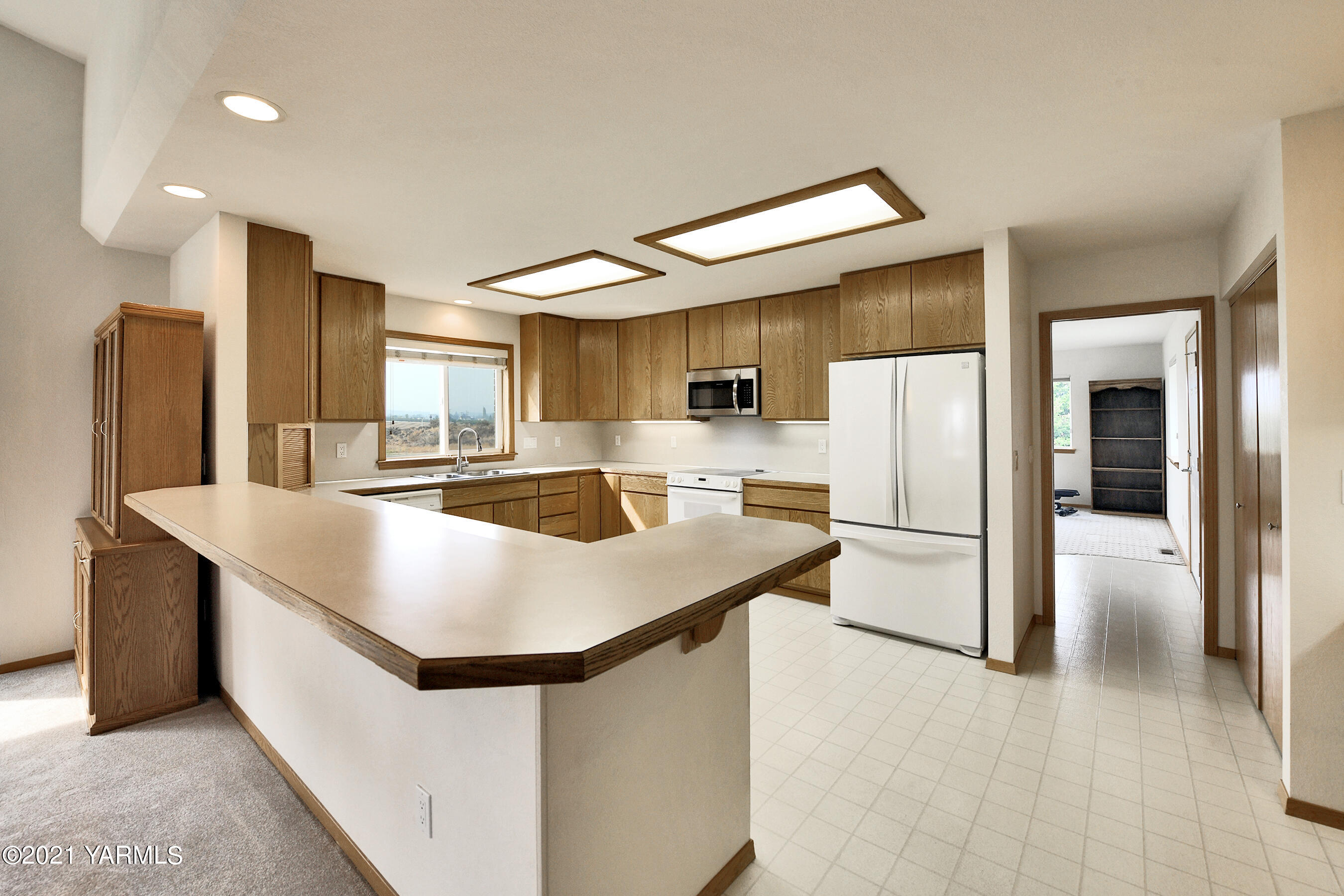 1511 Rosenkranz Road Tieton, WA 98947 - Photo 11 of 41 a kitchen with stainless steel appliances a refrigerator a stove a microwave and a refrigerator
