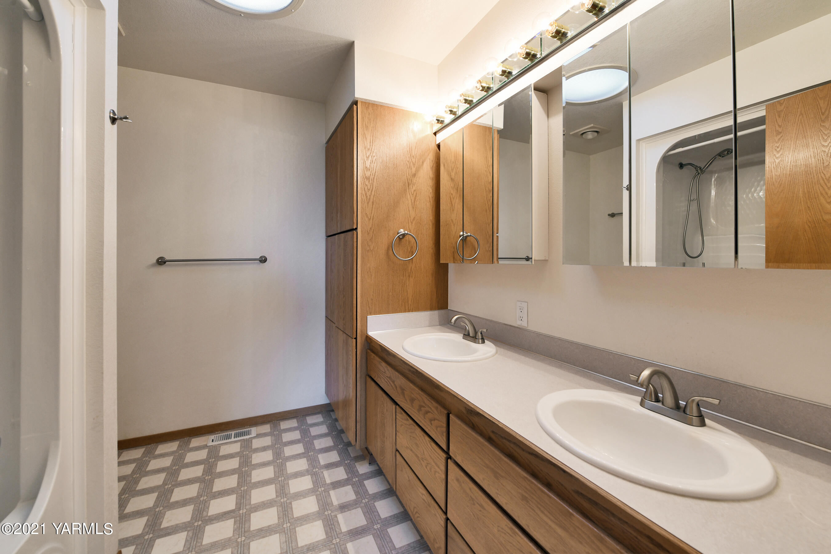 1511 Rosenkranz Road Tieton, WA 98947 - Photo 21 of 41 a bathroom with a double vanity sink and mirror