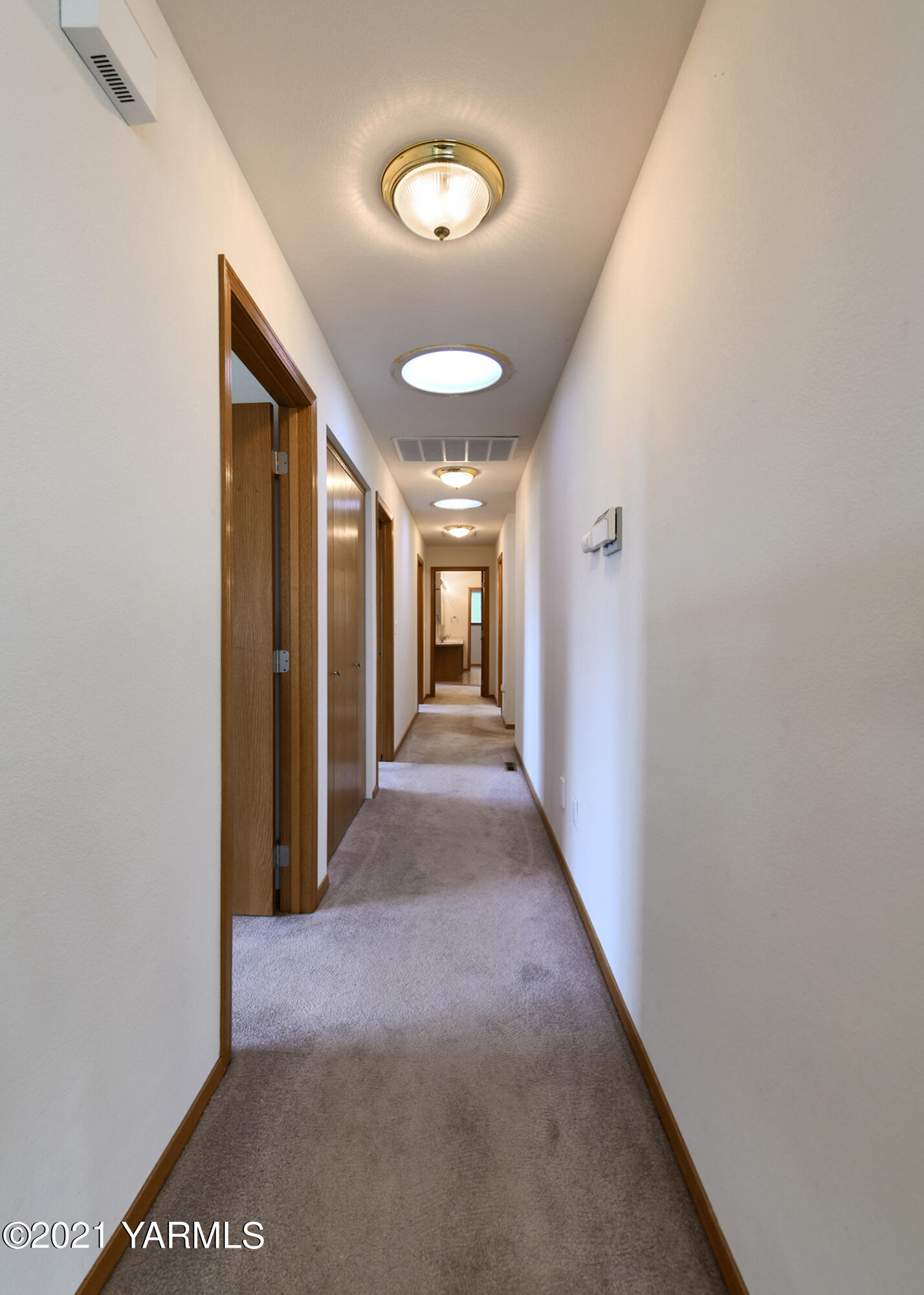 1511 Rosenkranz Road Tieton, WA 98947 - Photo 23 of 41 a view of a hallway with wooden floor and a hallway