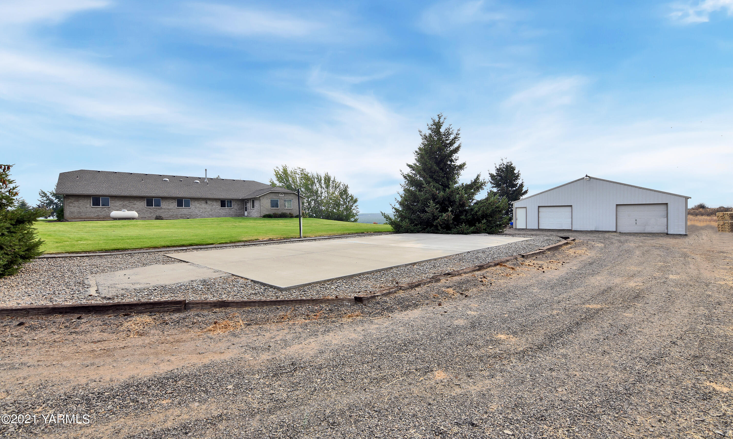 1511 Rosenkranz Road Tieton, WA 98947 - Photo 31 of 41 a view of a house with a yard and large trees
