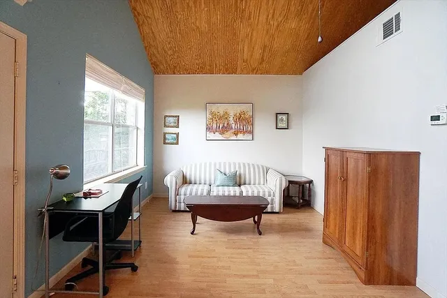 a living room with furniture and a window